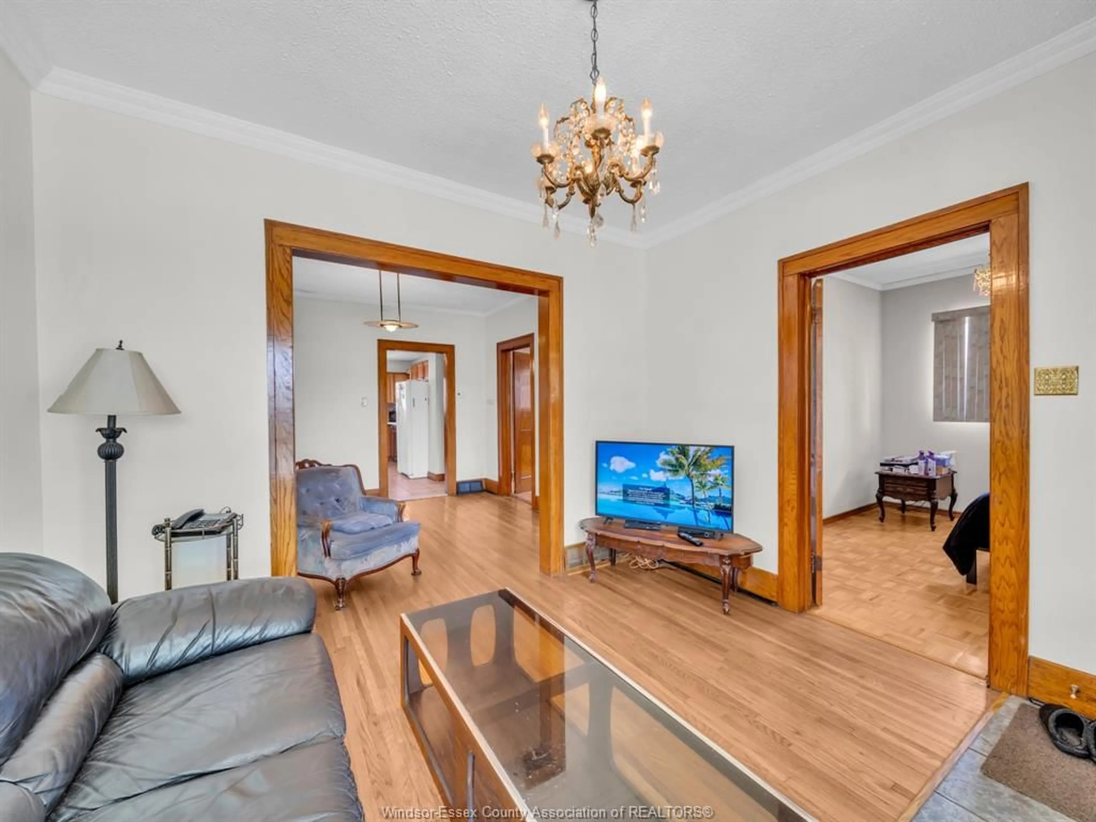 Living room with furniture, wood/laminate floor for 1061 HOWARD, Windsor Ontario N9A 1S6