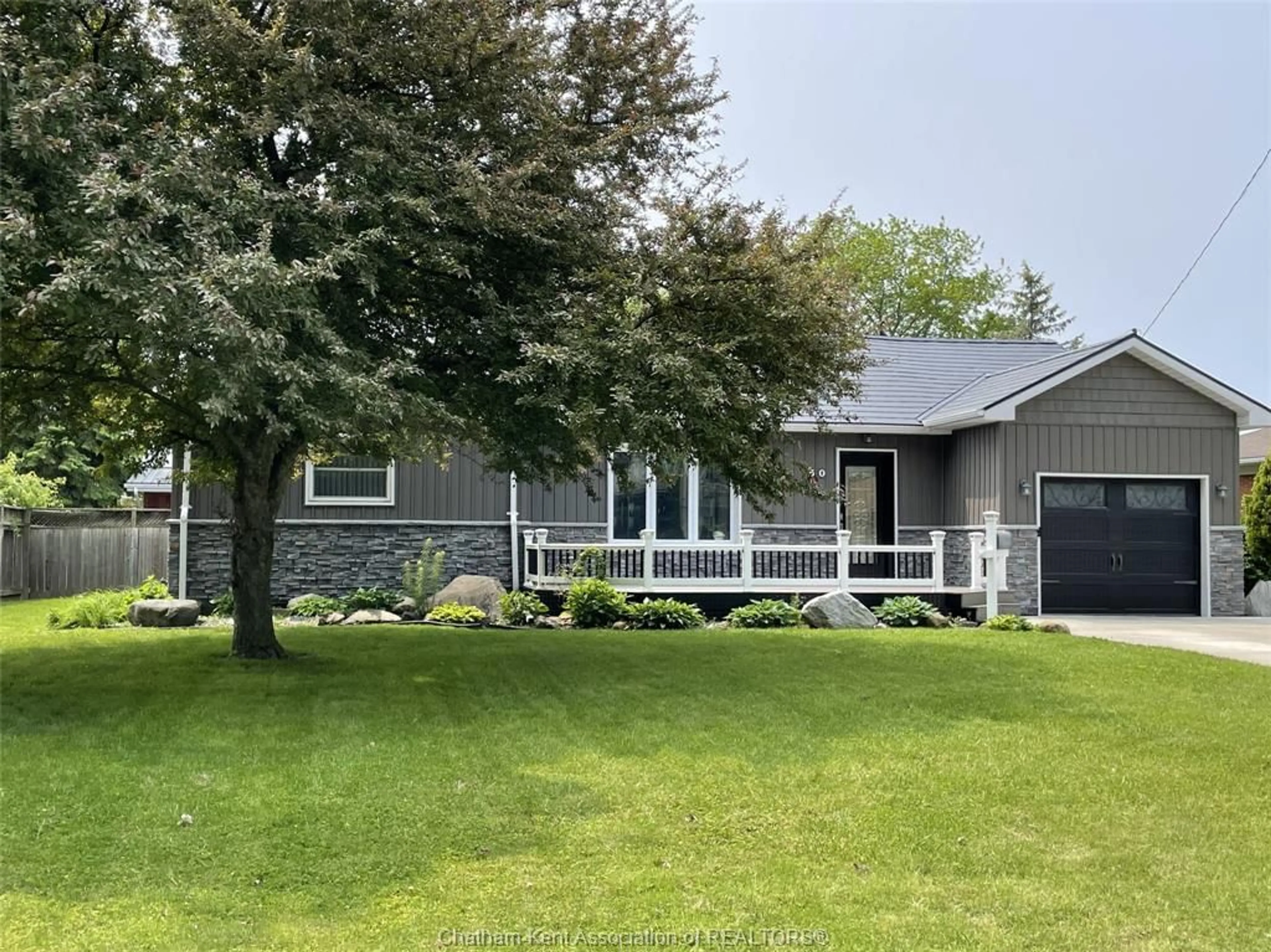Home with vinyl exterior material, street for 50 Phair Ave, Wallaceburg Ontario N8A 2M3