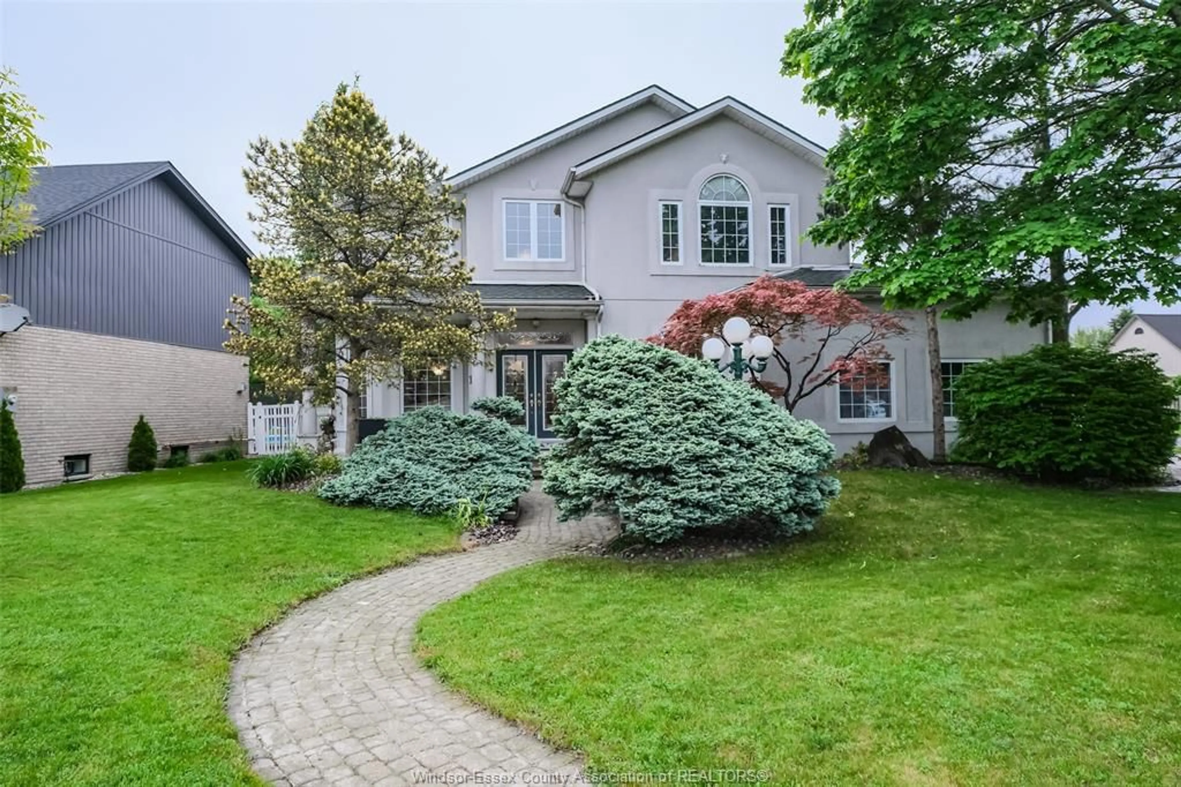 Home with brick exterior material, street for 106 MARTIN Dr, Lakeshore Ontario N8L 0Z5