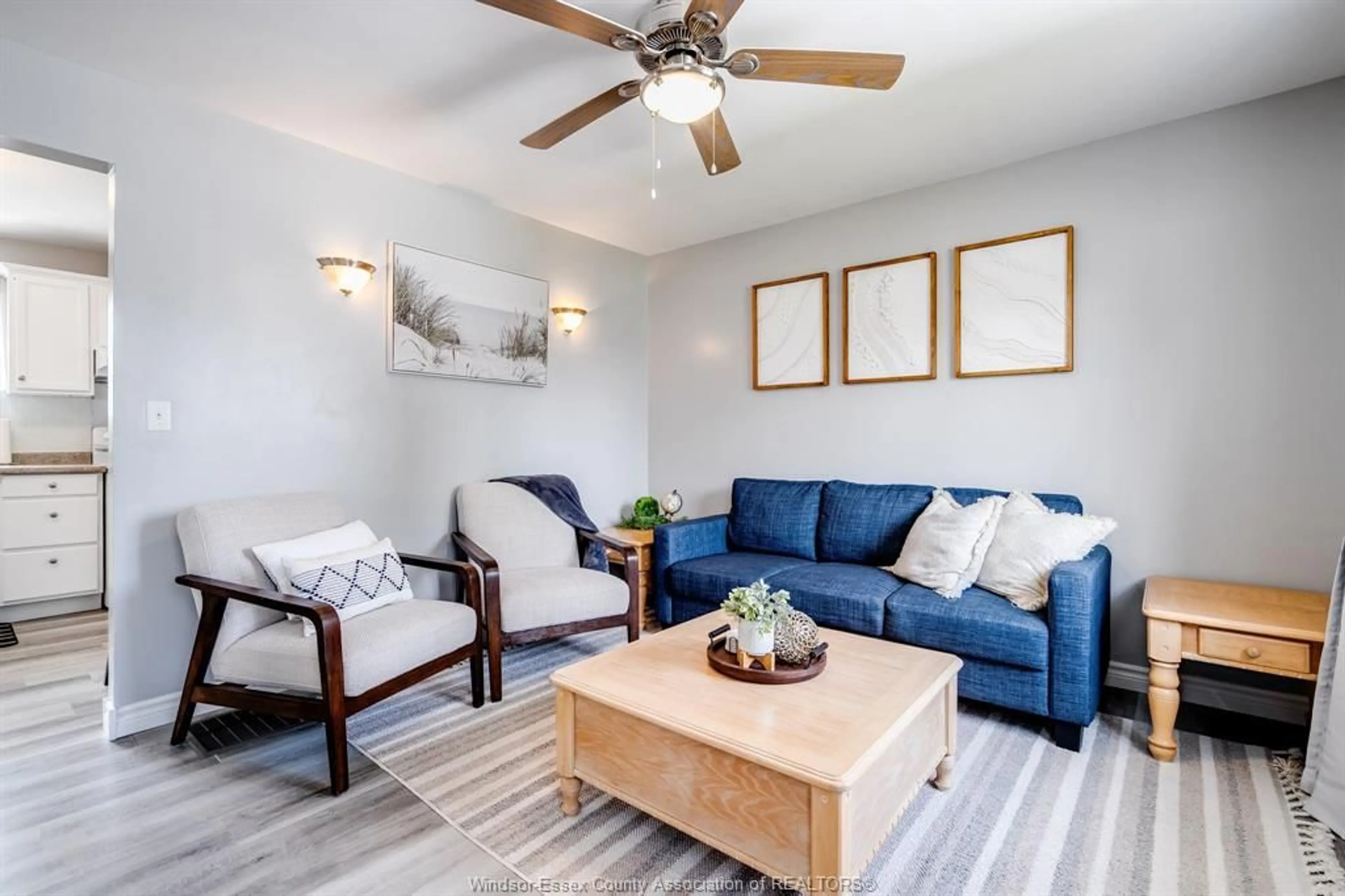 Living room with furniture, wood/laminate floor for 101 Erie St, Kingsville Ontario N9Y 1N2