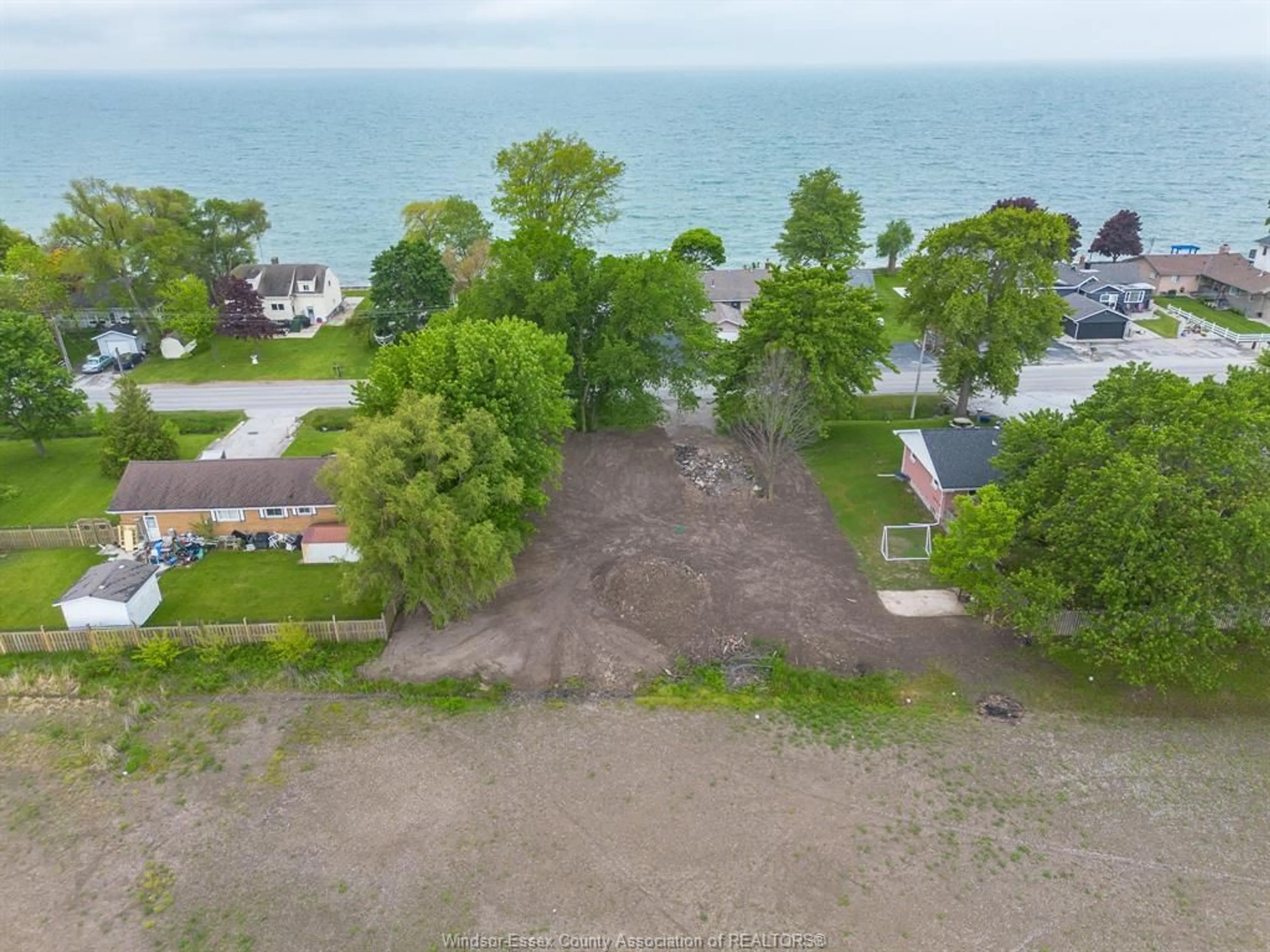 A pic from outside/outdoor area/front of a property/back of a property/a pic from drone, water/lake/river/ocean view for 775 POINT PELEE Dr, Leamington Ontario N8H 3V4