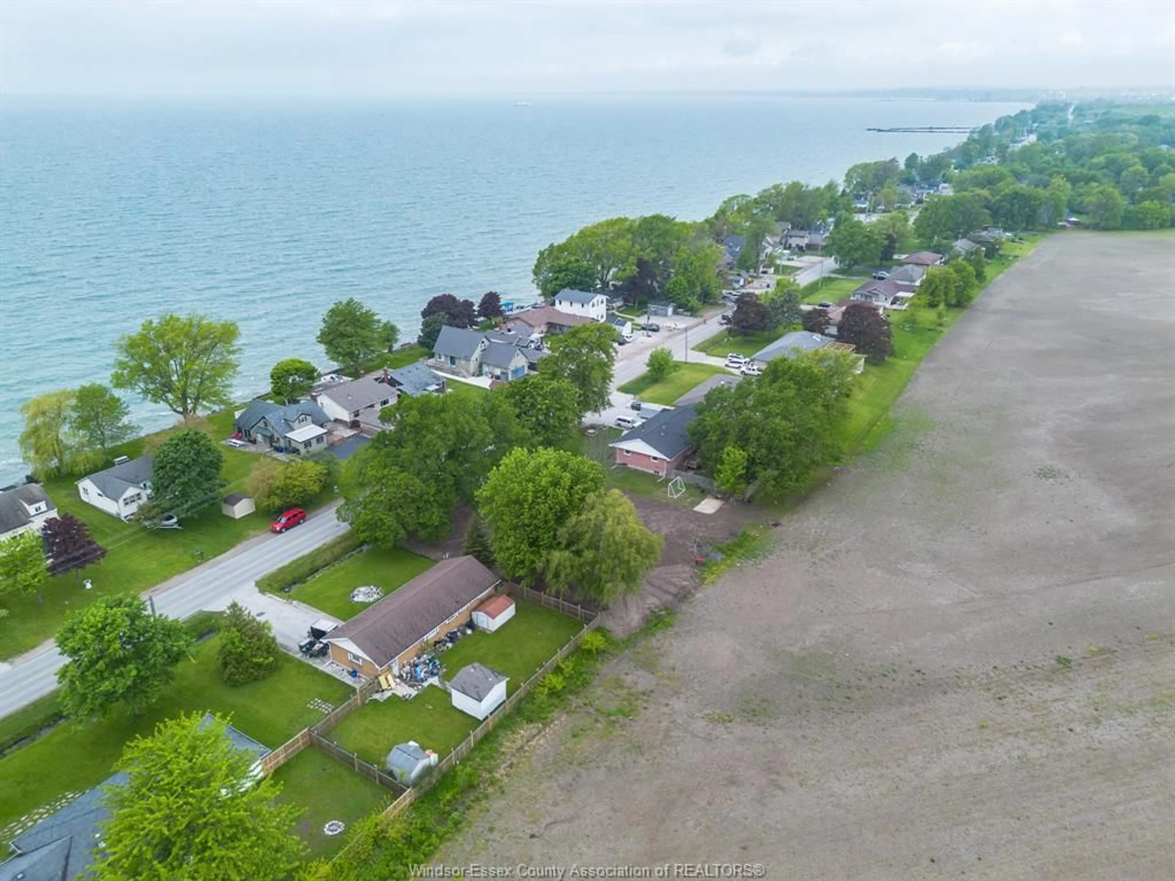 A pic from outside/outdoor area/front of a property/back of a property/a pic from drone, water/lake/river/ocean view for 775 POINT PELEE Dr, Leamington Ontario N8H 3V4