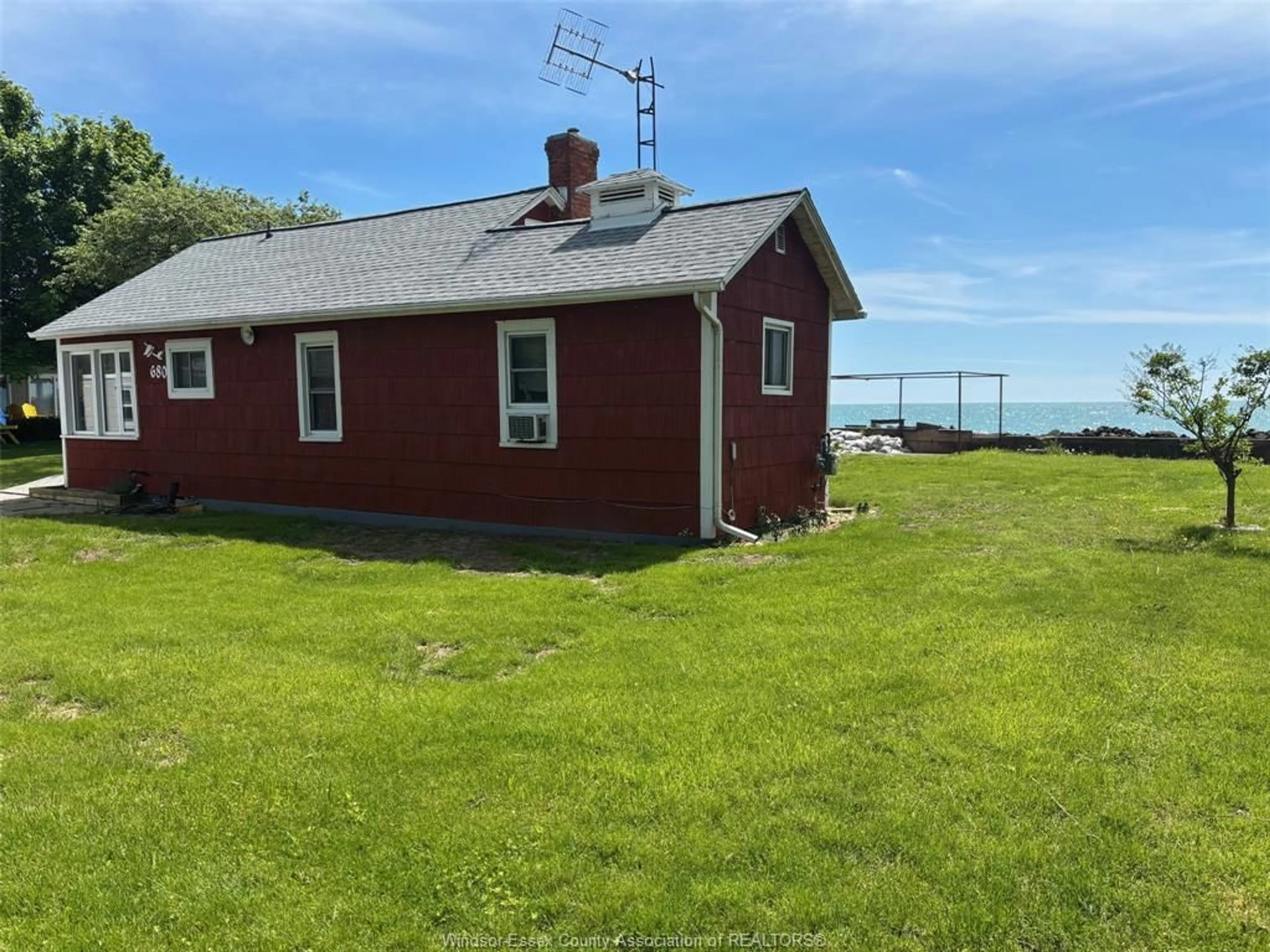 A pic from outside/outdoor area/front of a property/back of a property/a pic from drone, water/lake/river/ocean view for 680 POINT PELEE Dr, Leamington Ontario N8H 3V4