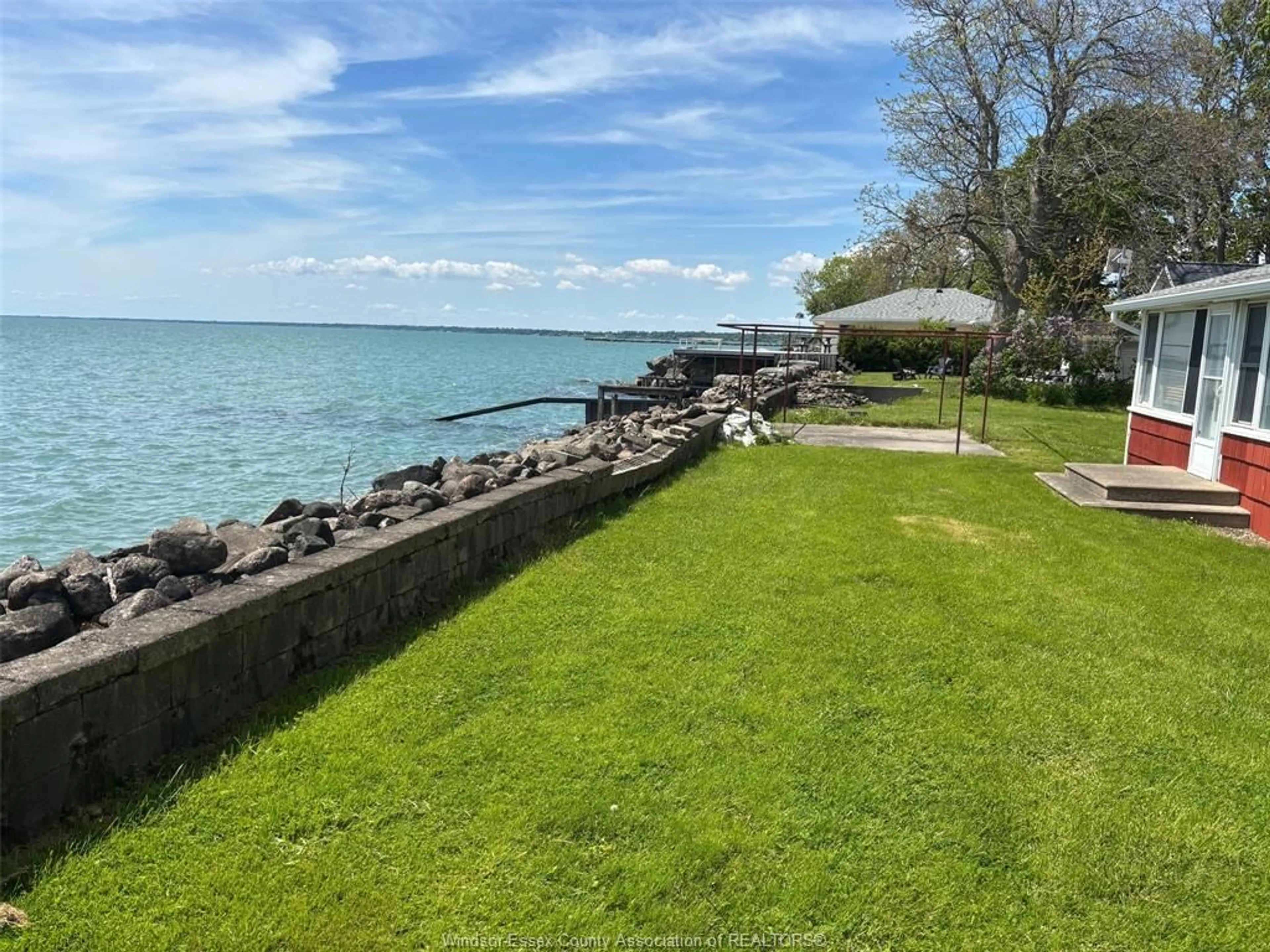 A pic from outside/outdoor area/front of a property/back of a property/a pic from drone, water/lake/river/ocean view for 680 POINT PELEE Dr, Leamington Ontario N8H 3V4
