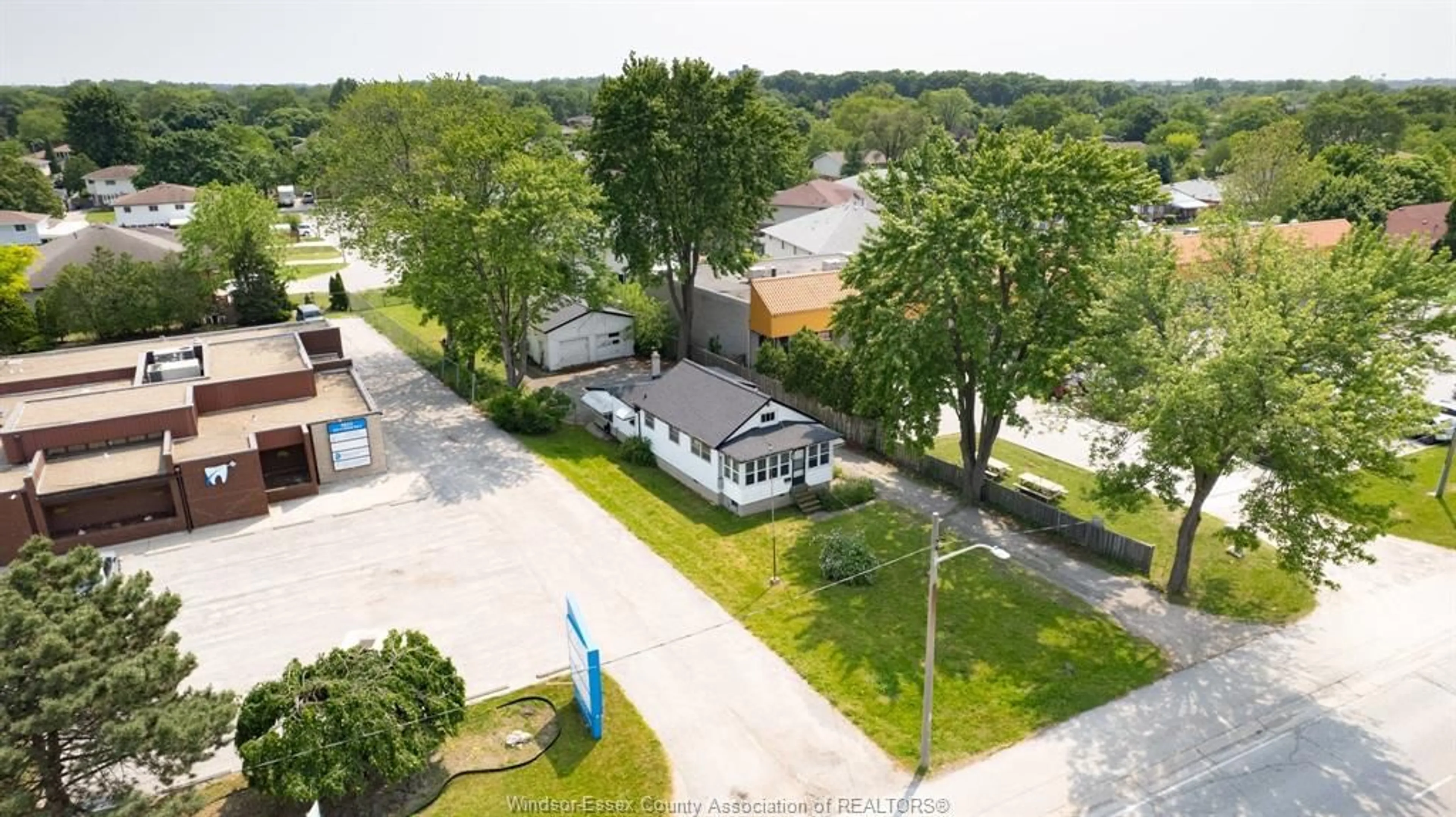 A pic from outside/outdoor area/front of a property/back of a property/a pic from drone, street for 9803 TECUMSEH Rd, Windsor Ontario N8R 1A5
