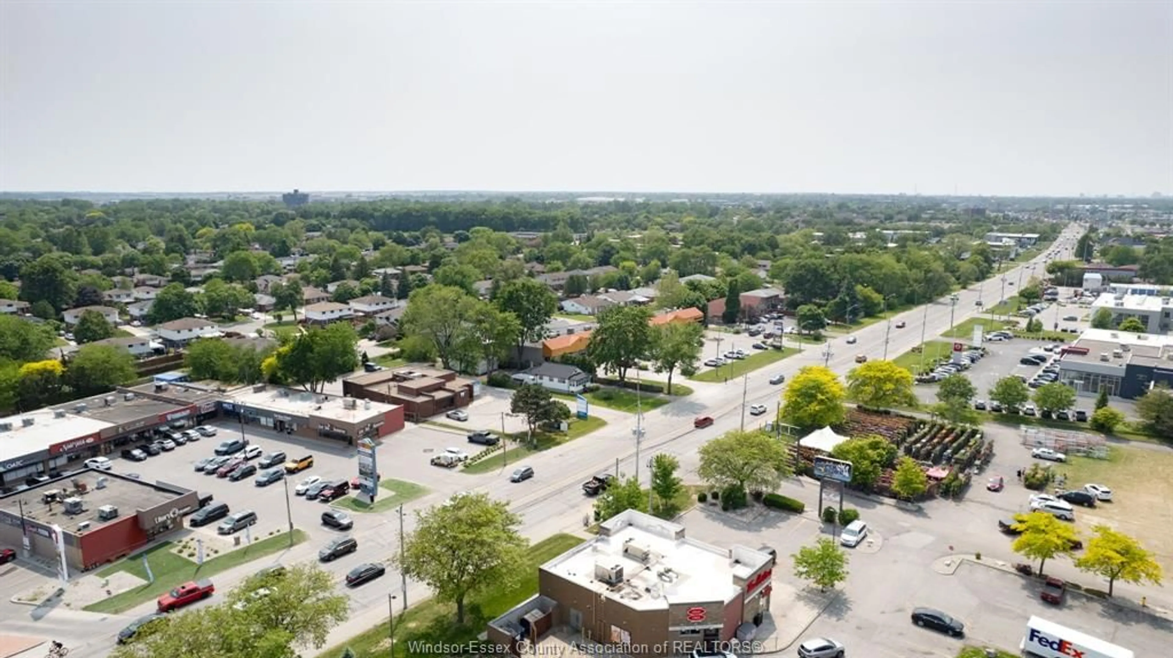 A pic from outside/outdoor area/front of a property/back of a property/a pic from drone, city buildings view from balcony for 9803 TECUMSEH Rd, Windsor Ontario N8R 1A5