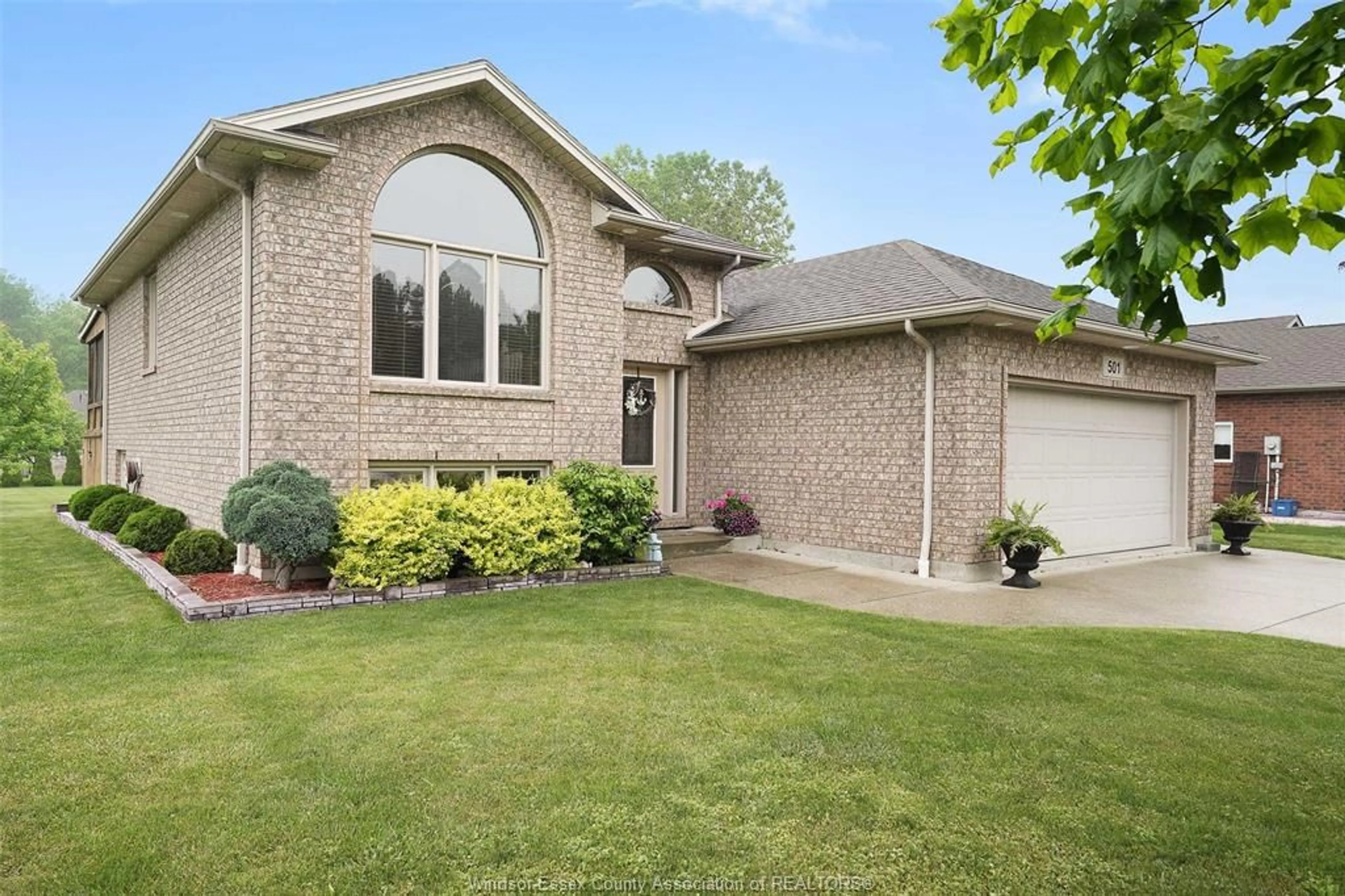Home with brick exterior material, street for 501 Emily Lane, Wheatley Ontario N0P 2P0