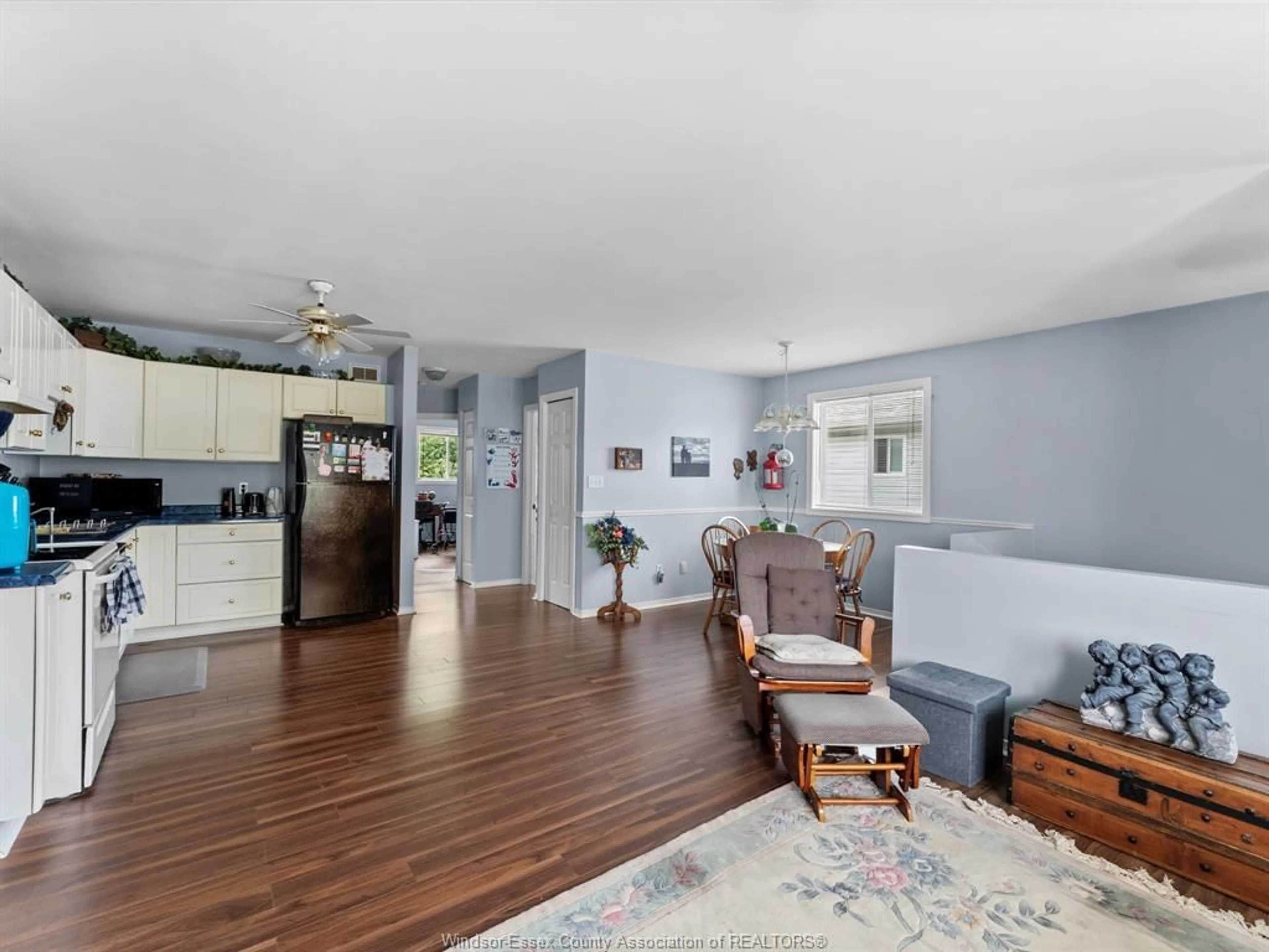 Living room with furniture, wood/laminate floor for 3302 CANDLEWOOD Cres, Windsor Ontario N8W 5M5