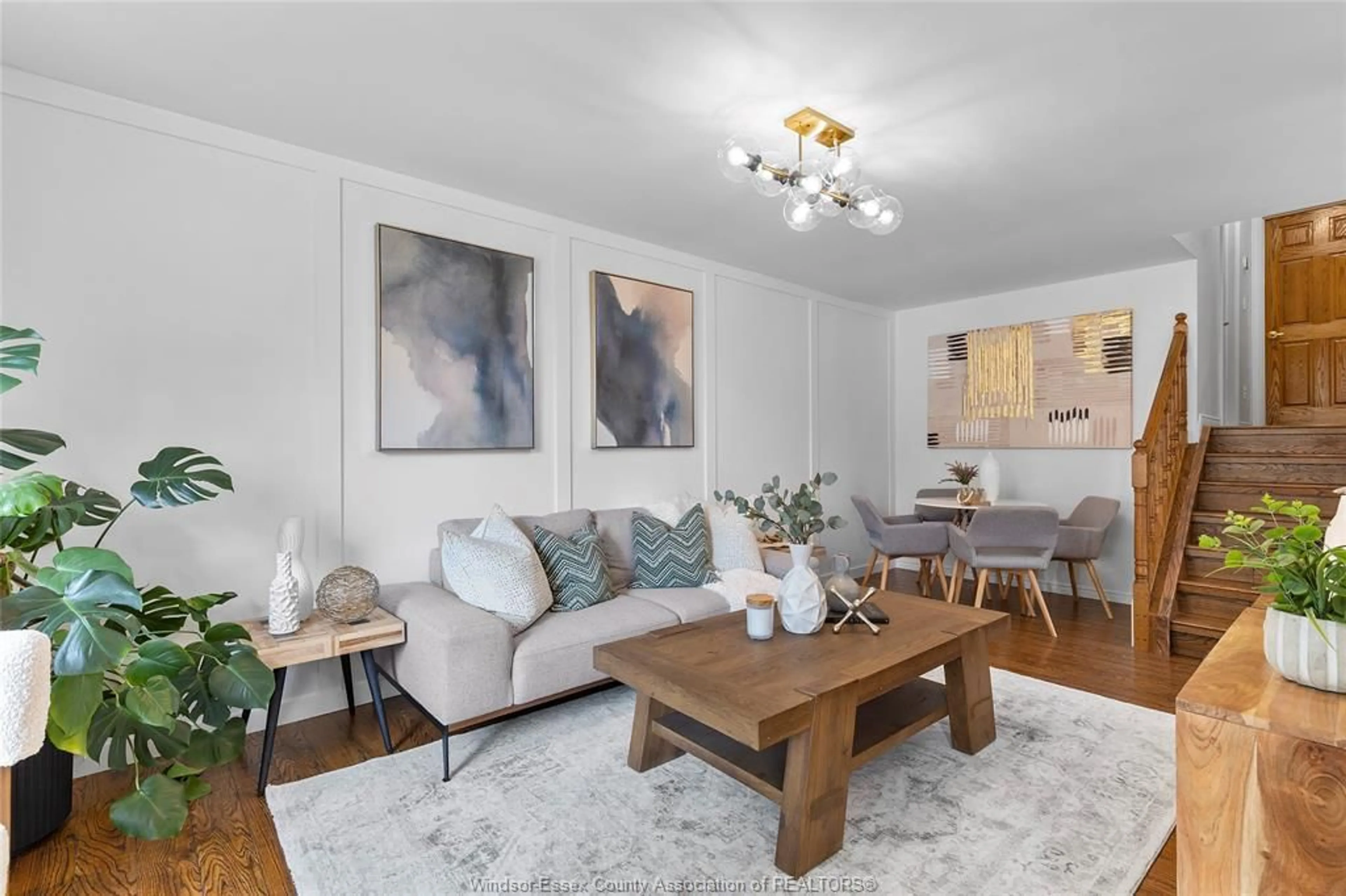 Living room with furniture, wood/laminate floor for 3605 STEPHANIE Crt, Windsor Ontario N8W 5G5