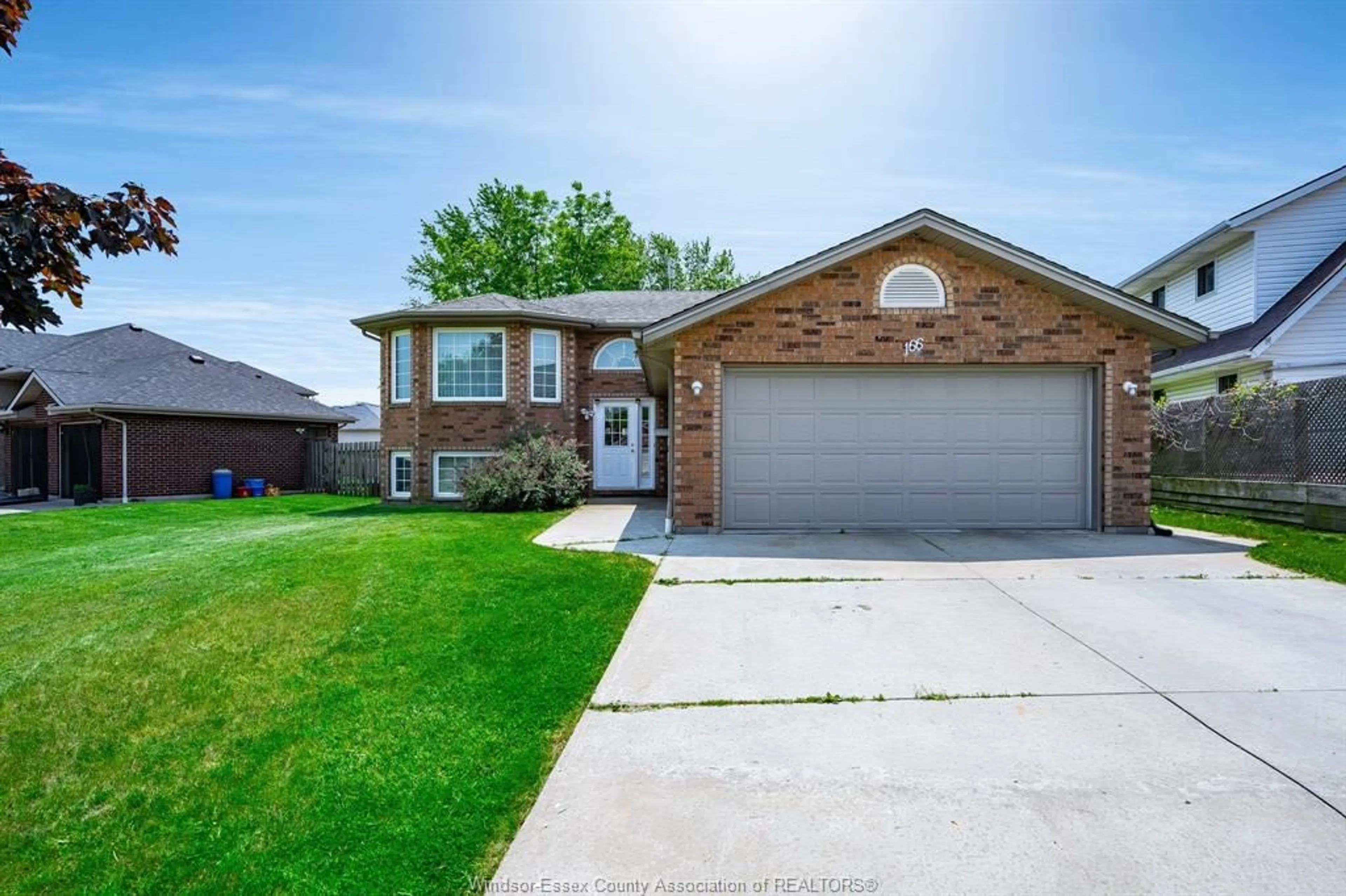 Home with brick exterior material, street for 166 STURGEON MEADOWS, Leamington Ontario N8H 5M7