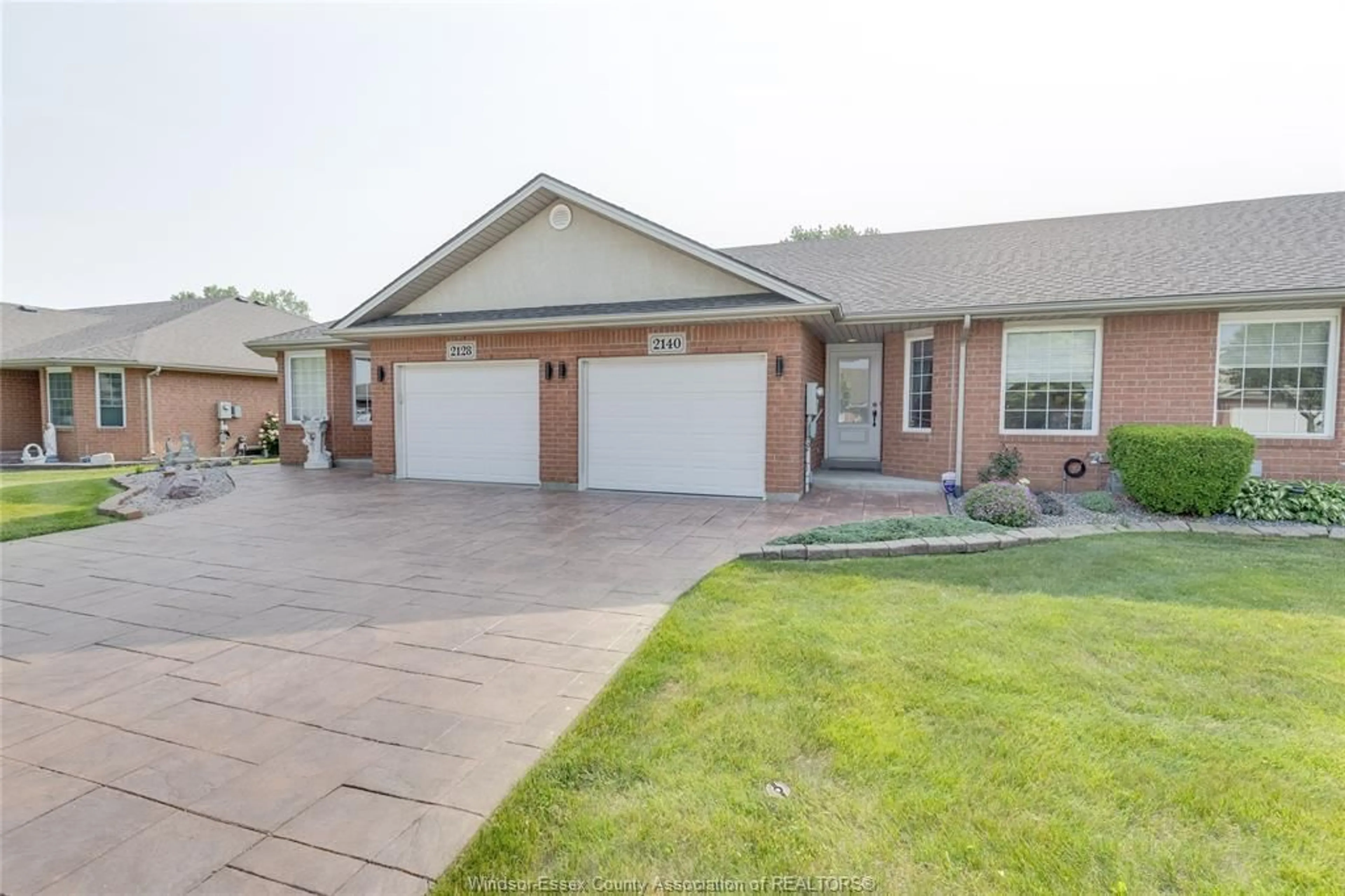 Home with brick exterior material, street for 2140 QUESTA Dr, Windsor Ontario N8P 1N8