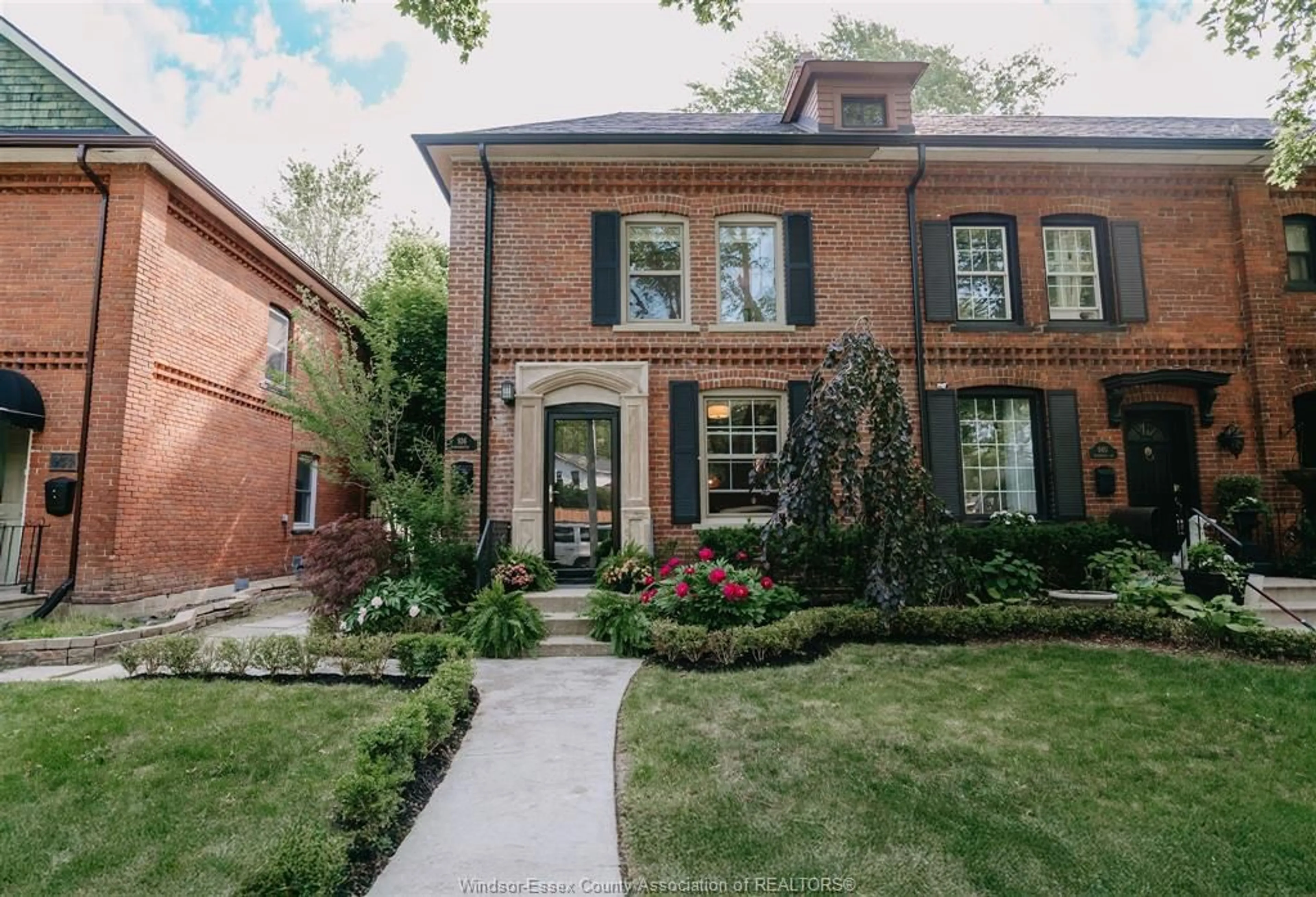 Home with brick exterior material, street for 936 Monmouth Rd, Windsor Ontario N8Y 3L7