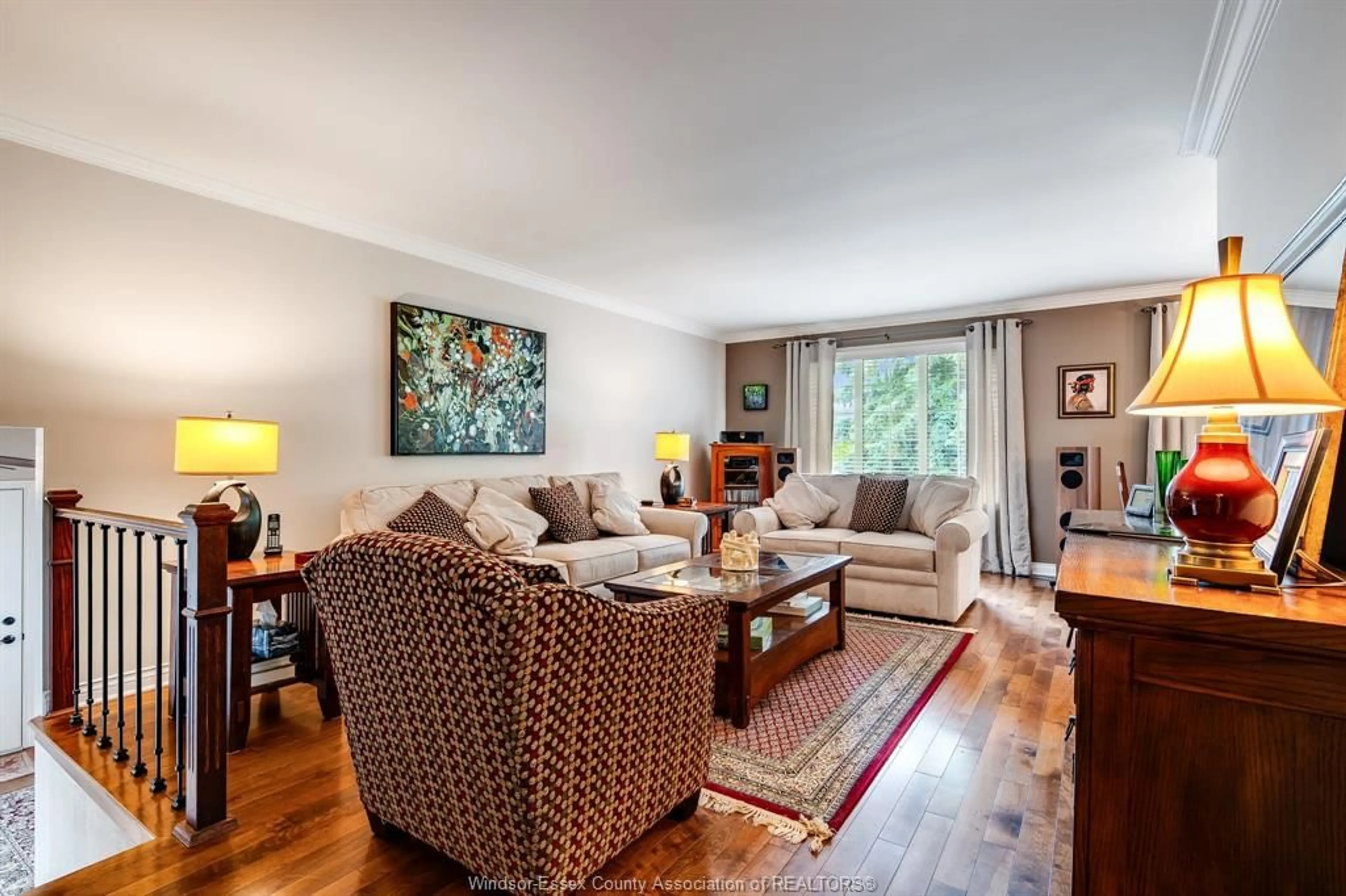 Living room with furniture, wood/laminate floor for 1202 Nottingham, Kingsville Ontario N9Y 3K7