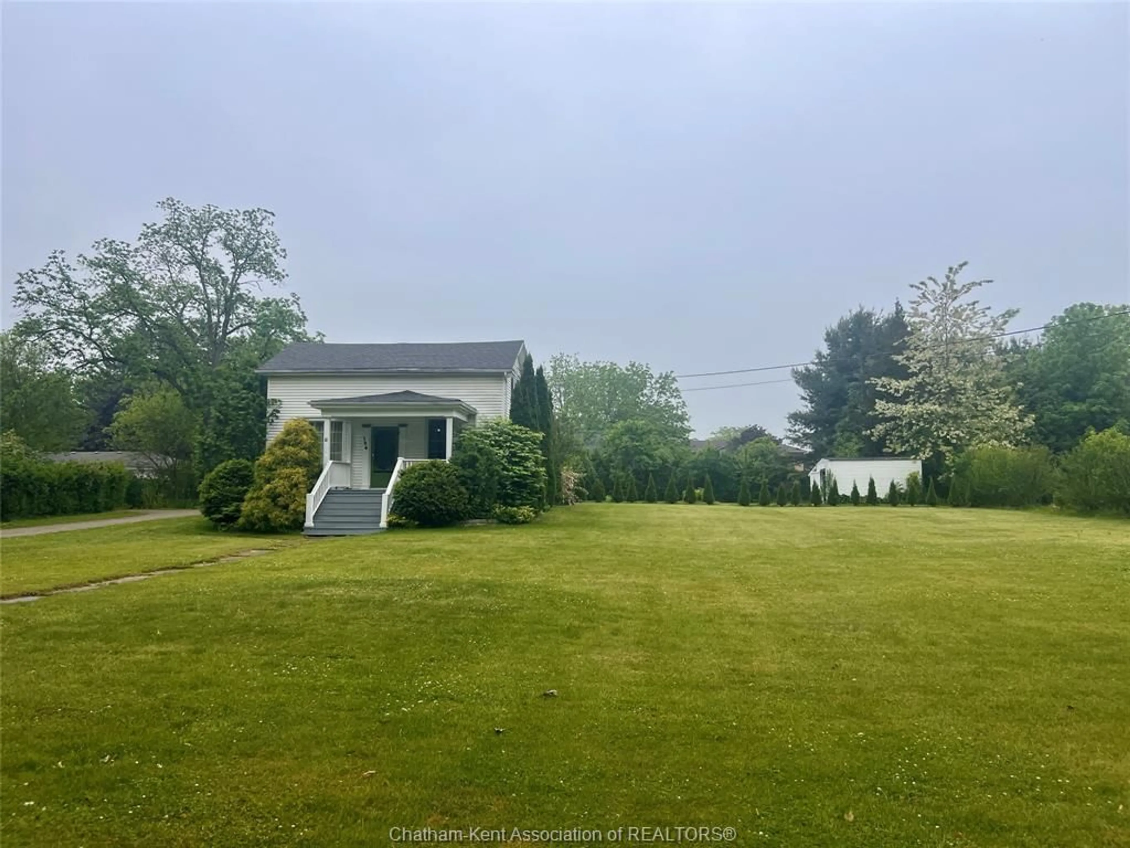 A pic from outside/outdoor area/front of a property/back of a property/a pic from drone, water/lake/river/ocean view for 106 Main St, Ridgetown Ontario N0P 2C0
