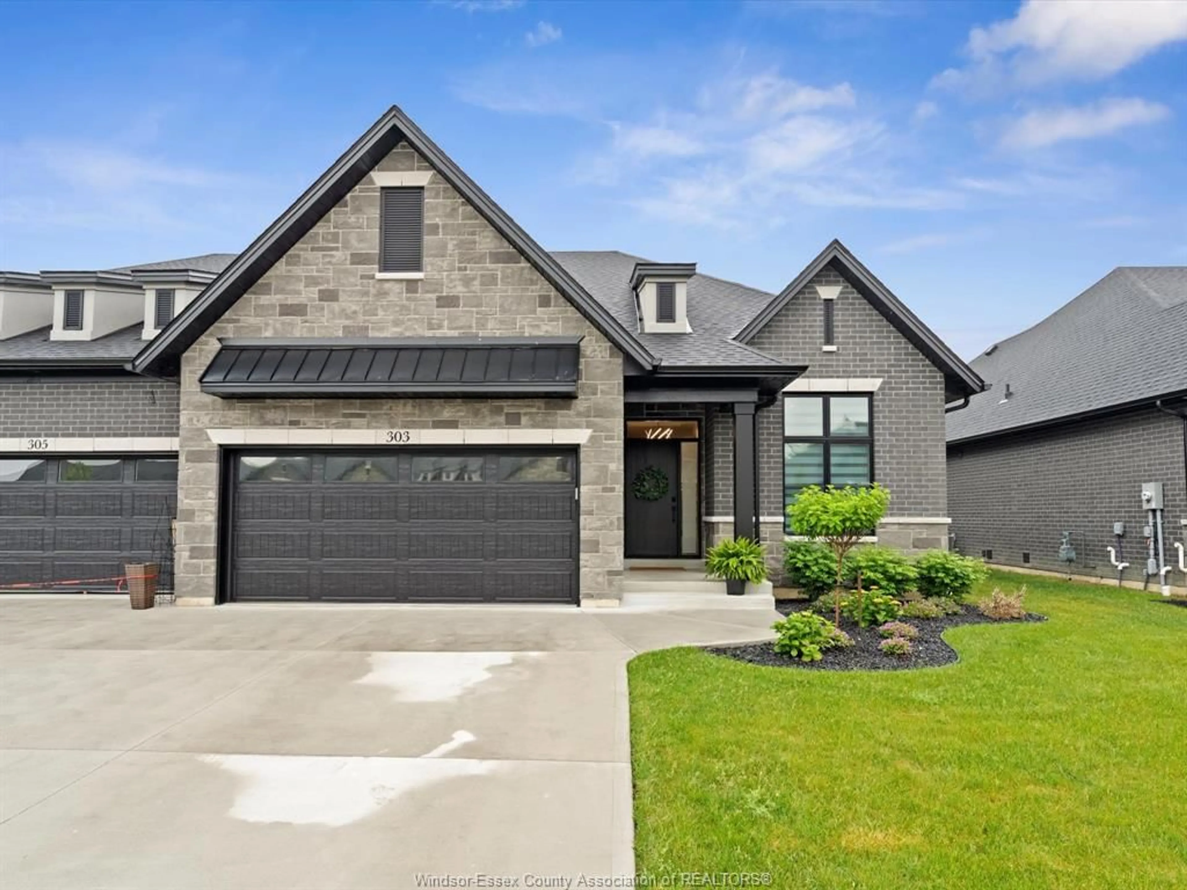 Home with brick exterior material, street for 303 XAVIER Cir, Lakeshore Ontario N8N 0J3
