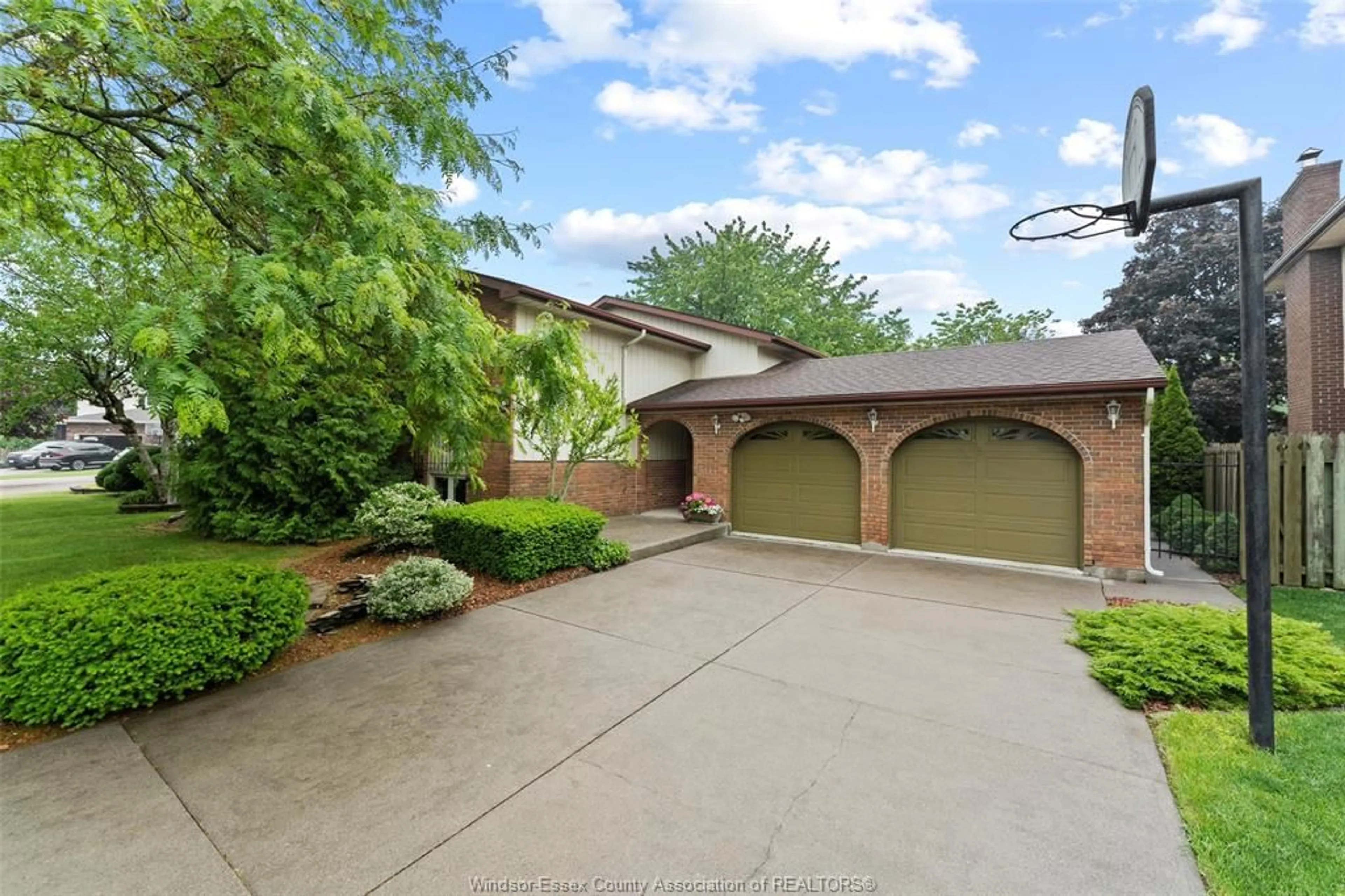 Home with brick exterior material, street for 223 WEDGEWOOD Lane, Tecumseh Ontario N8N 4J4