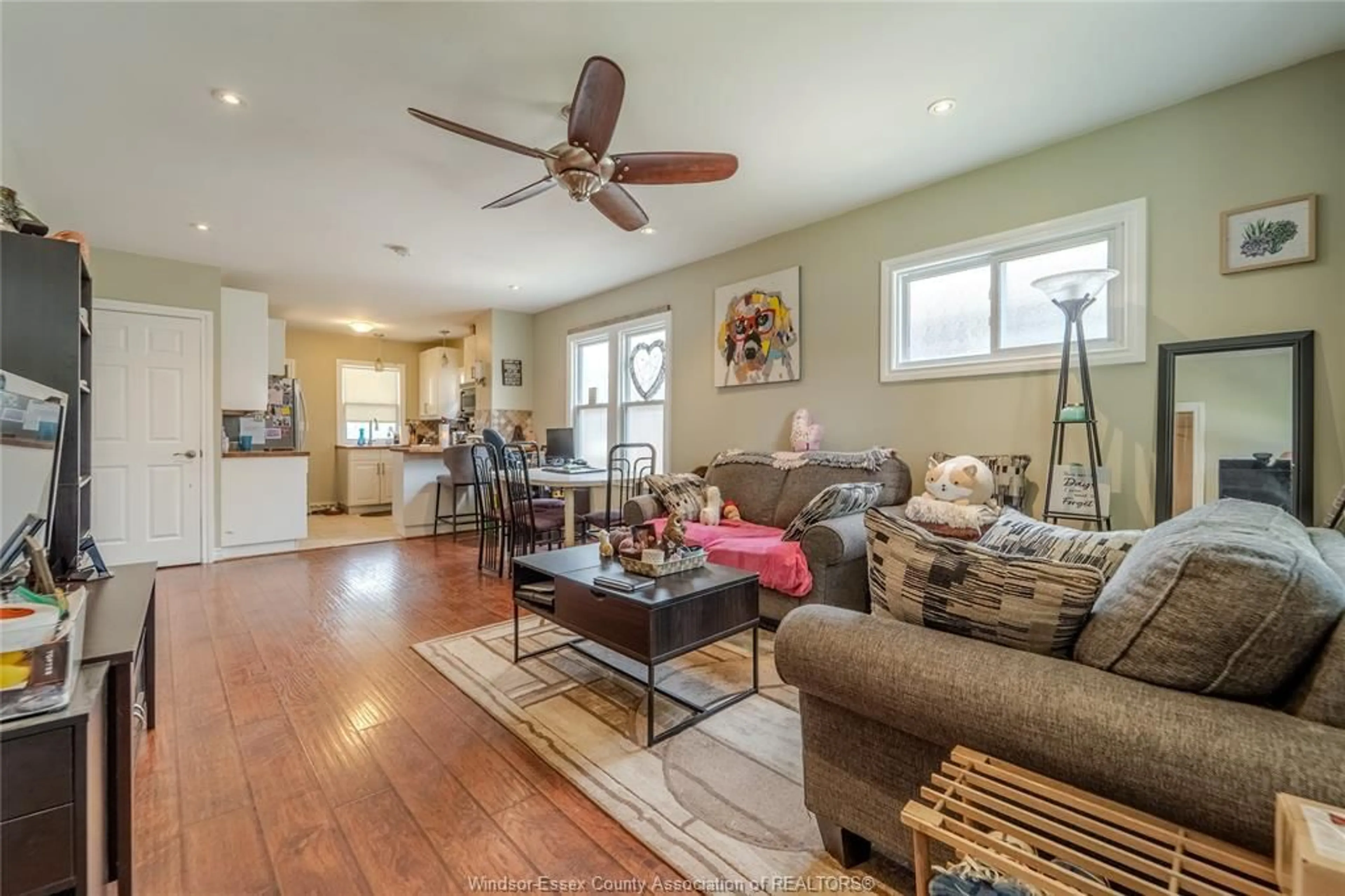 Living room with furniture, wood/laminate floor for 1463 Pierre, Windsor Ontario N8X 4P4