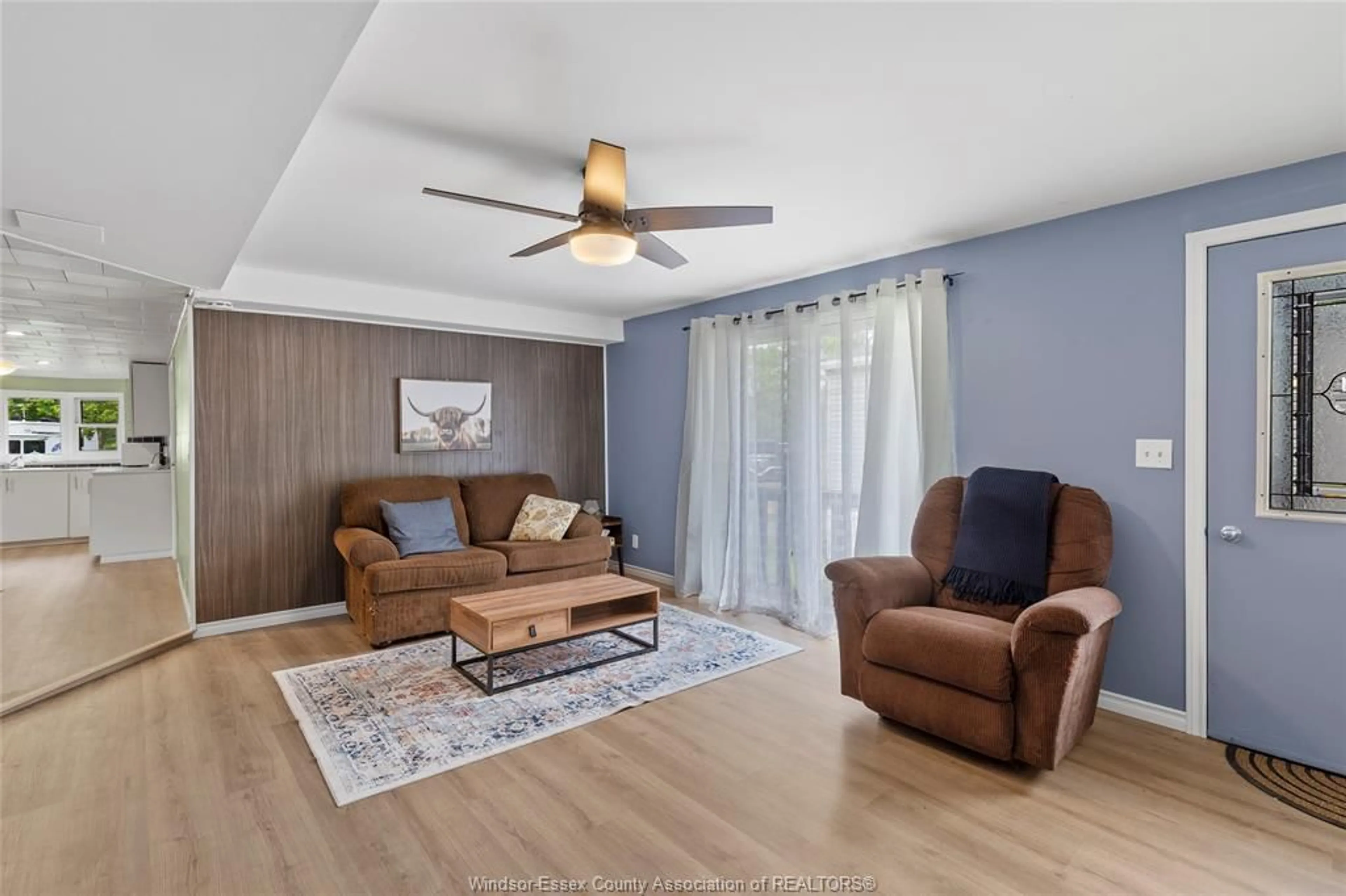 Living room with furniture, wood/laminate floor for 20951 PIER Rd #12 LAKE, Wheatley Ontario N0P 2P0