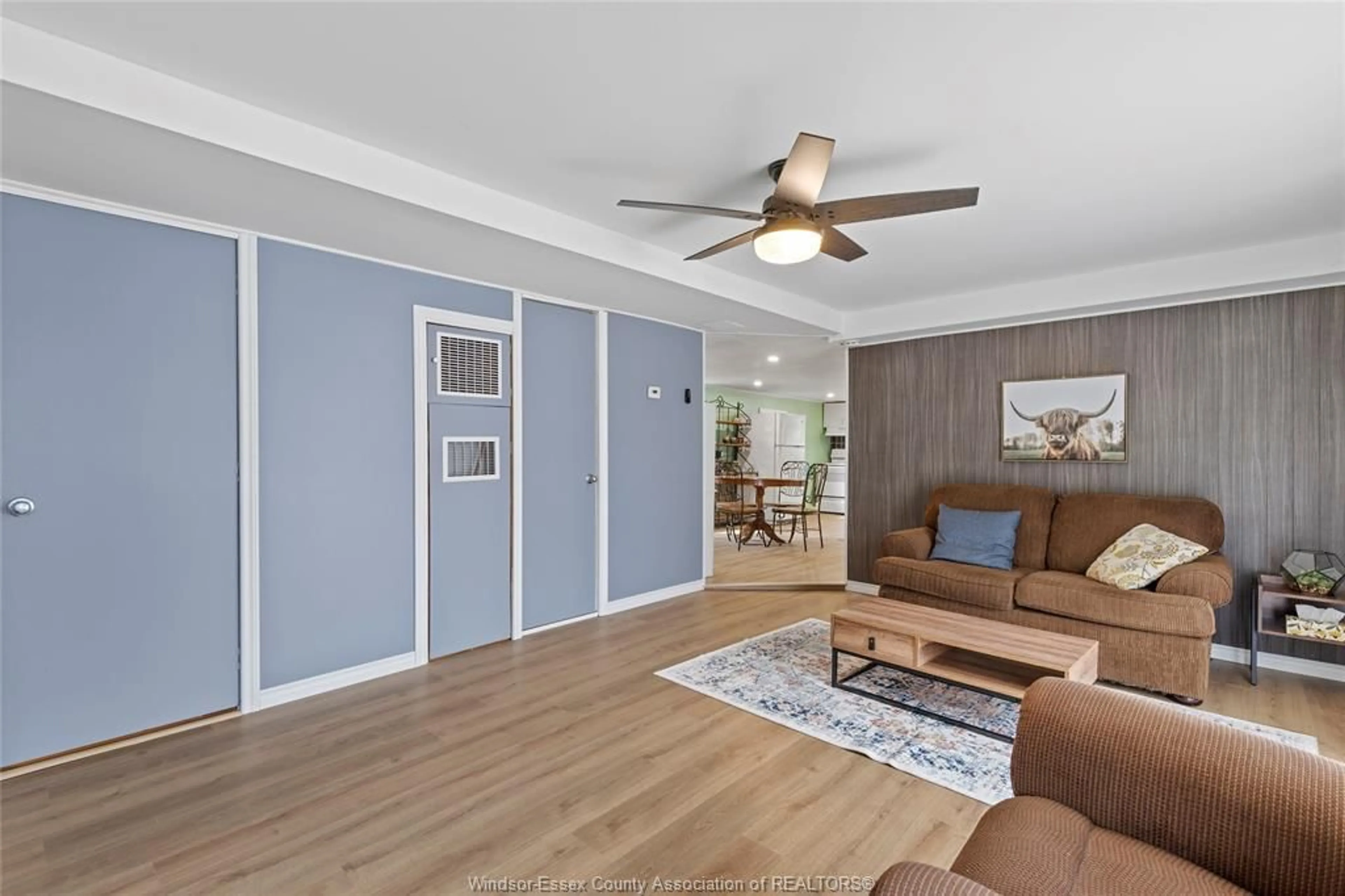 Living room with furniture, wood/laminate floor for 20951 PIER Rd #12 LAKE, Wheatley Ontario N0P 2P0