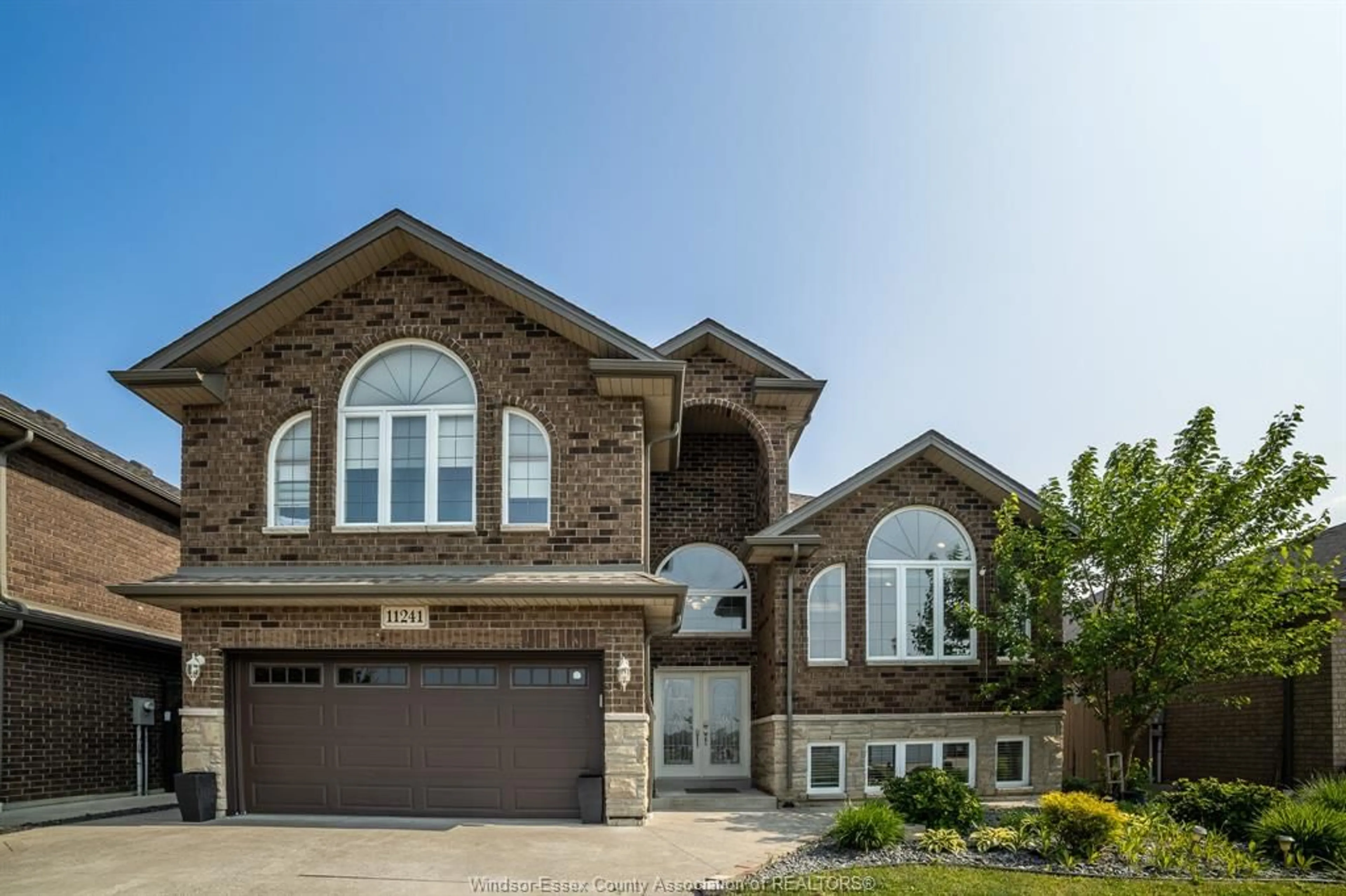 Home with brick exterior material, street for 11241 URBAN Lane, Windsor Ontario N8R 0A6