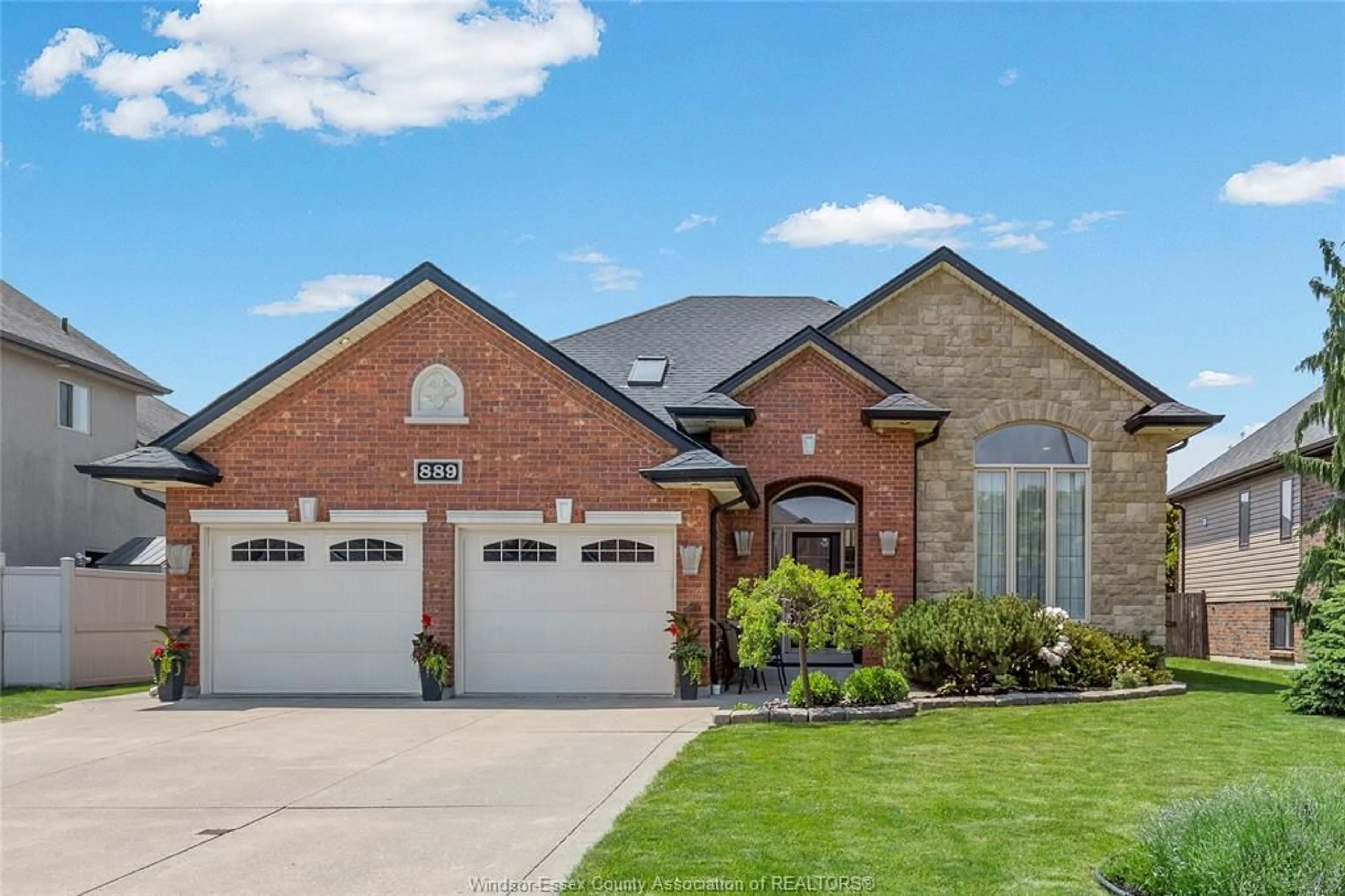 Home with brick exterior material, street for 889 DRIFTWOOD, Lakeshore Ontario N8L 1G4