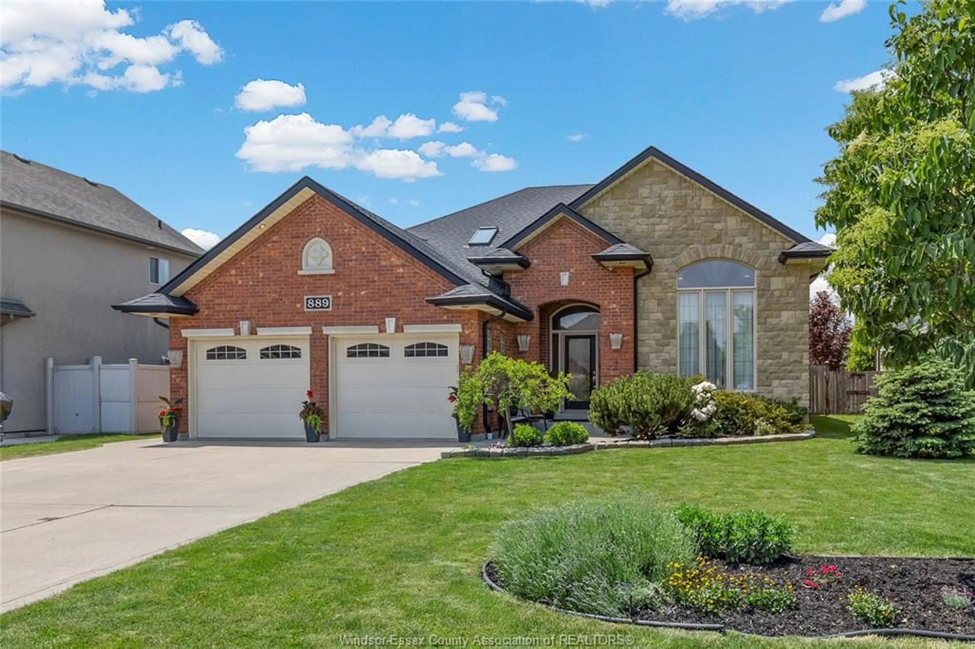 Home with brick exterior material, street for 889 DRIFTWOOD, Lakeshore Ontario N8L 1G4