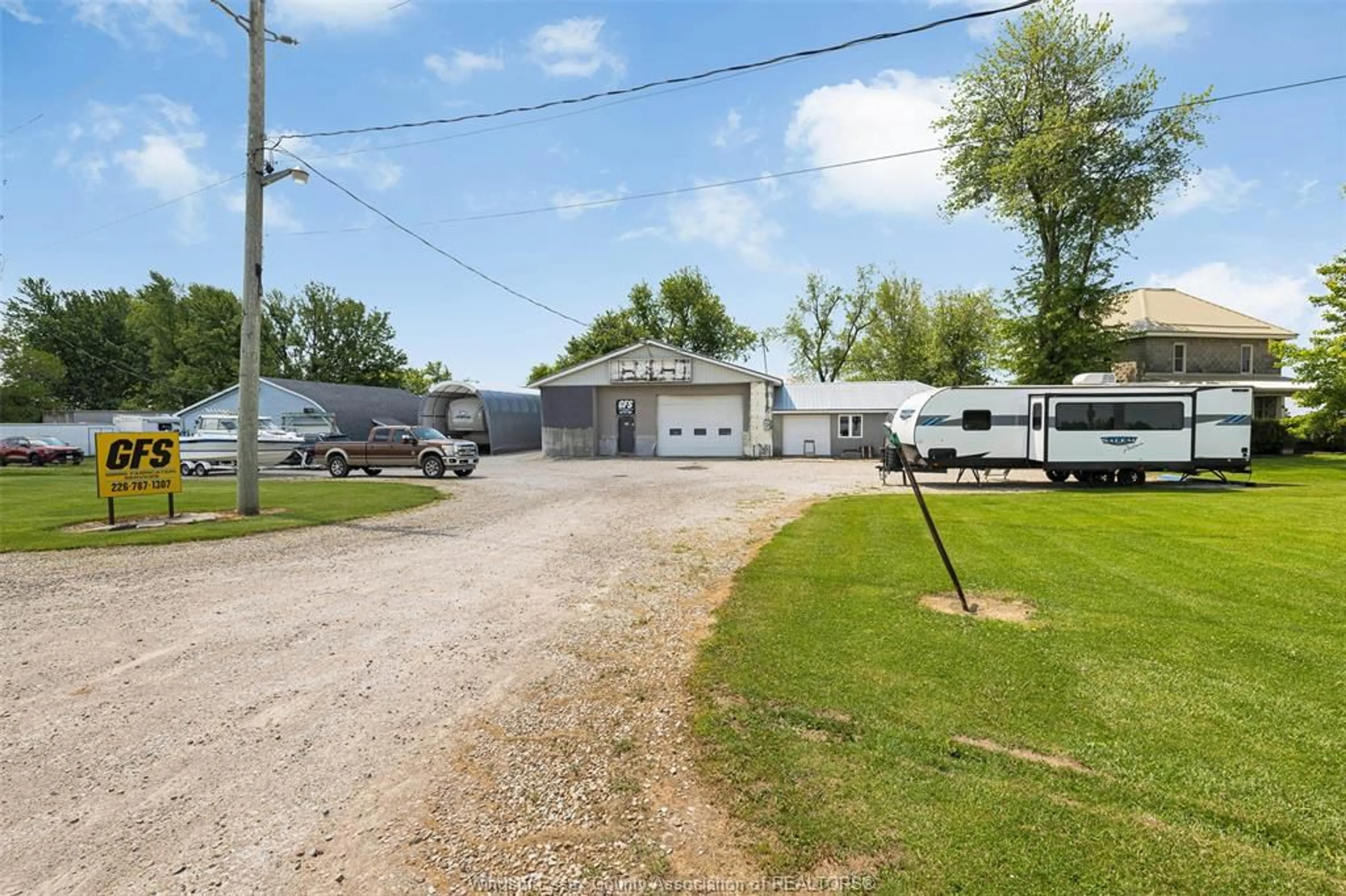 A pic from outside/outdoor area/front of a property/back of a property/a pic from drone, street for 1104 County Road 11, Essex Ontario N9V 2Y7