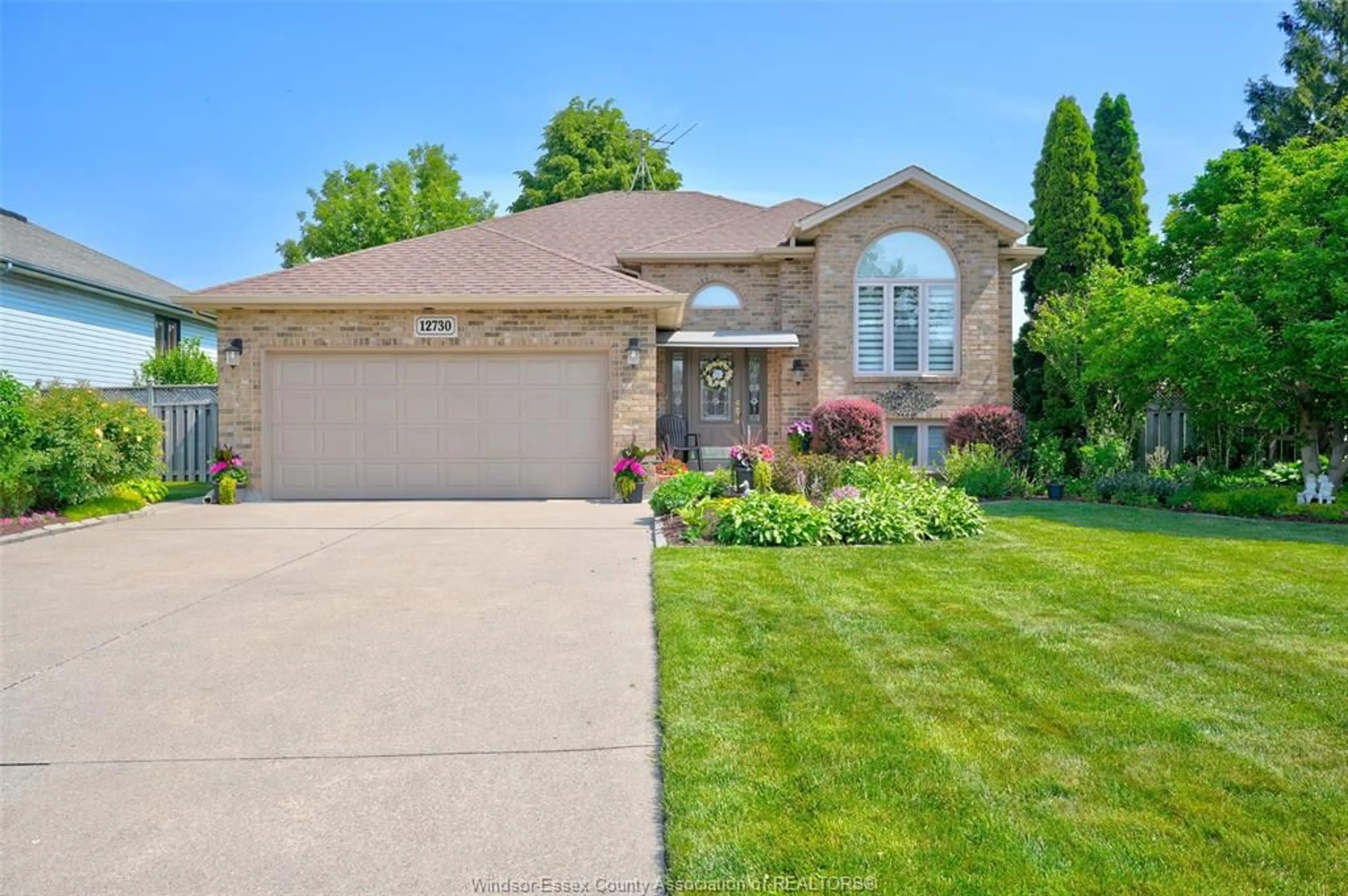 Home with brick exterior material, street for 12730 NORTHFIELD Way, Tecumseh Ontario N8N 4W8