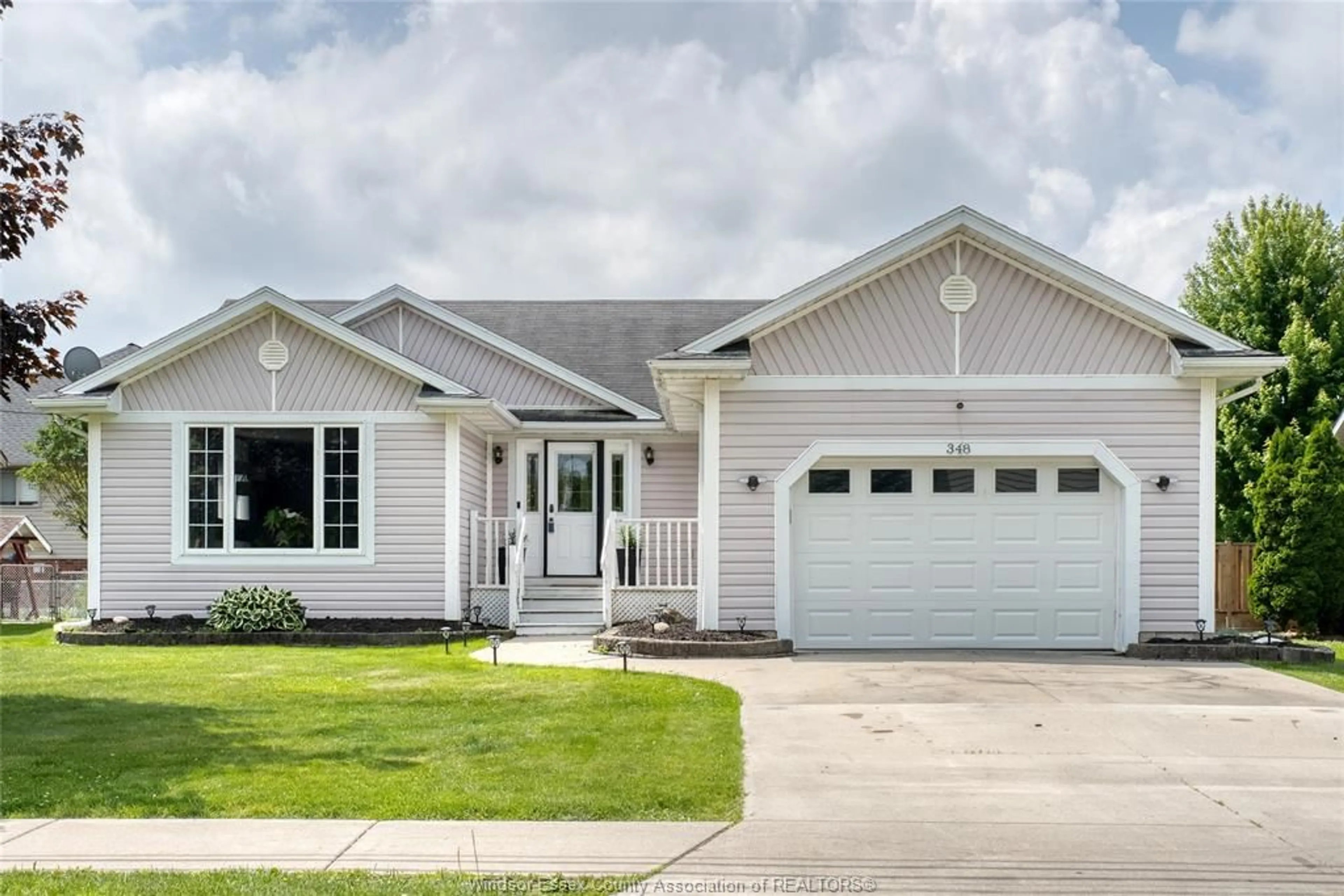 Home with vinyl exterior material, street for 348 ST PETER St, Belle River Ontario N0R 1A0