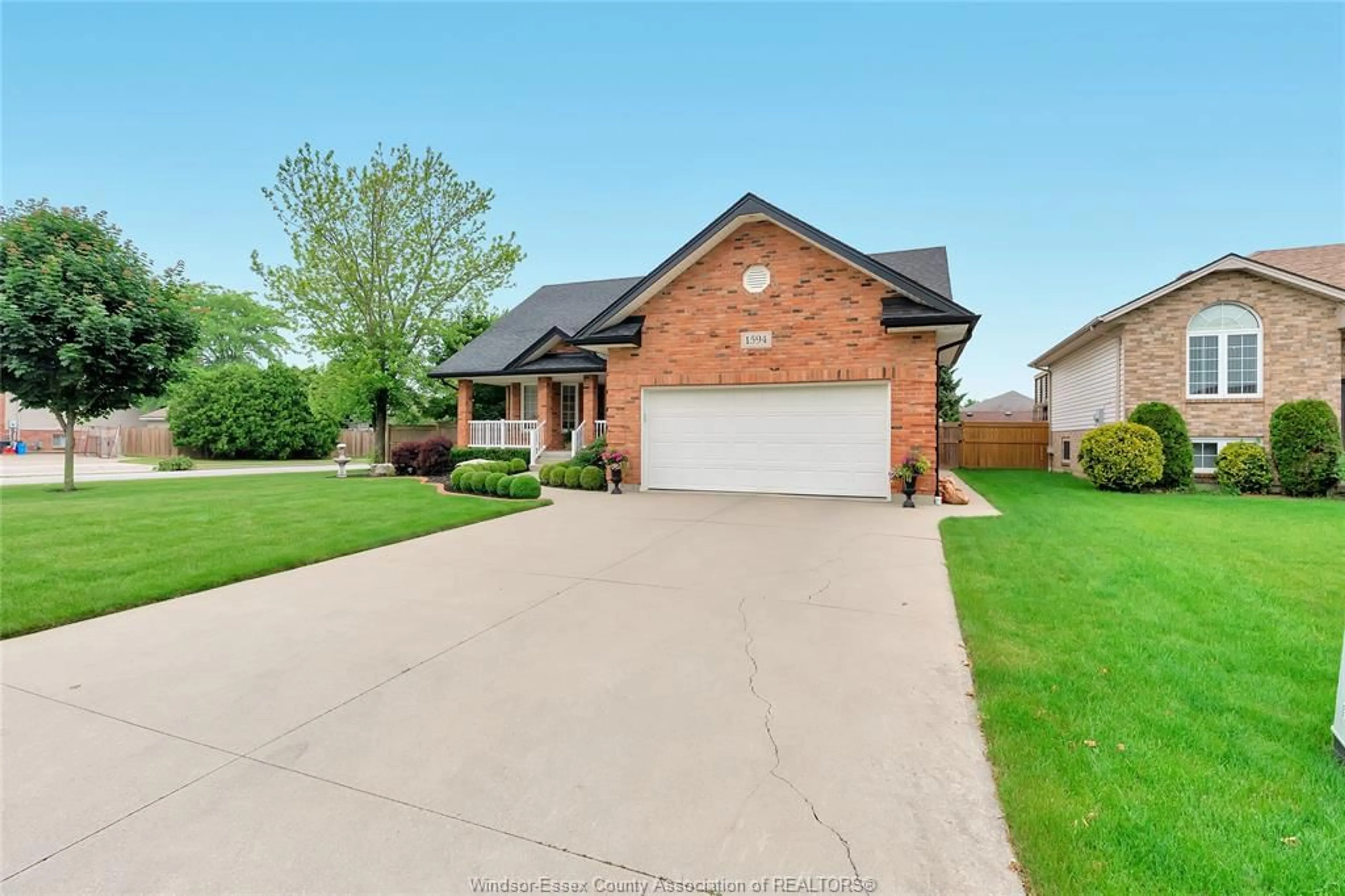 Home with brick exterior material, street for 1594 WHITEWOOD Dr, Lakeshore Ontario N0R 1A0