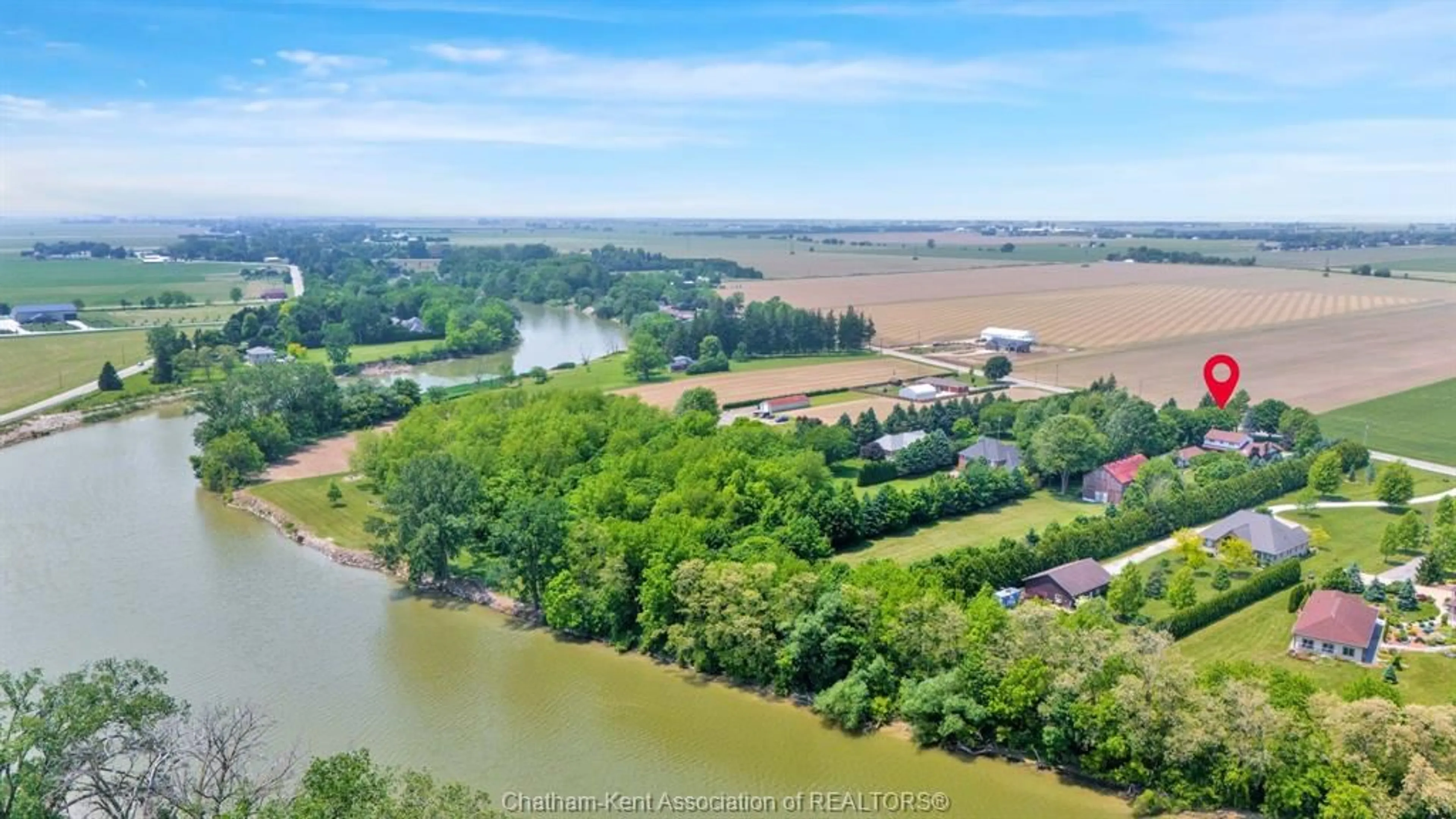 A pic from outside/outdoor area/front of a property/back of a property/a pic from drone, water/lake/river/ocean view for 7308 Grande River Line, Chatham Ontario N7M 0N3