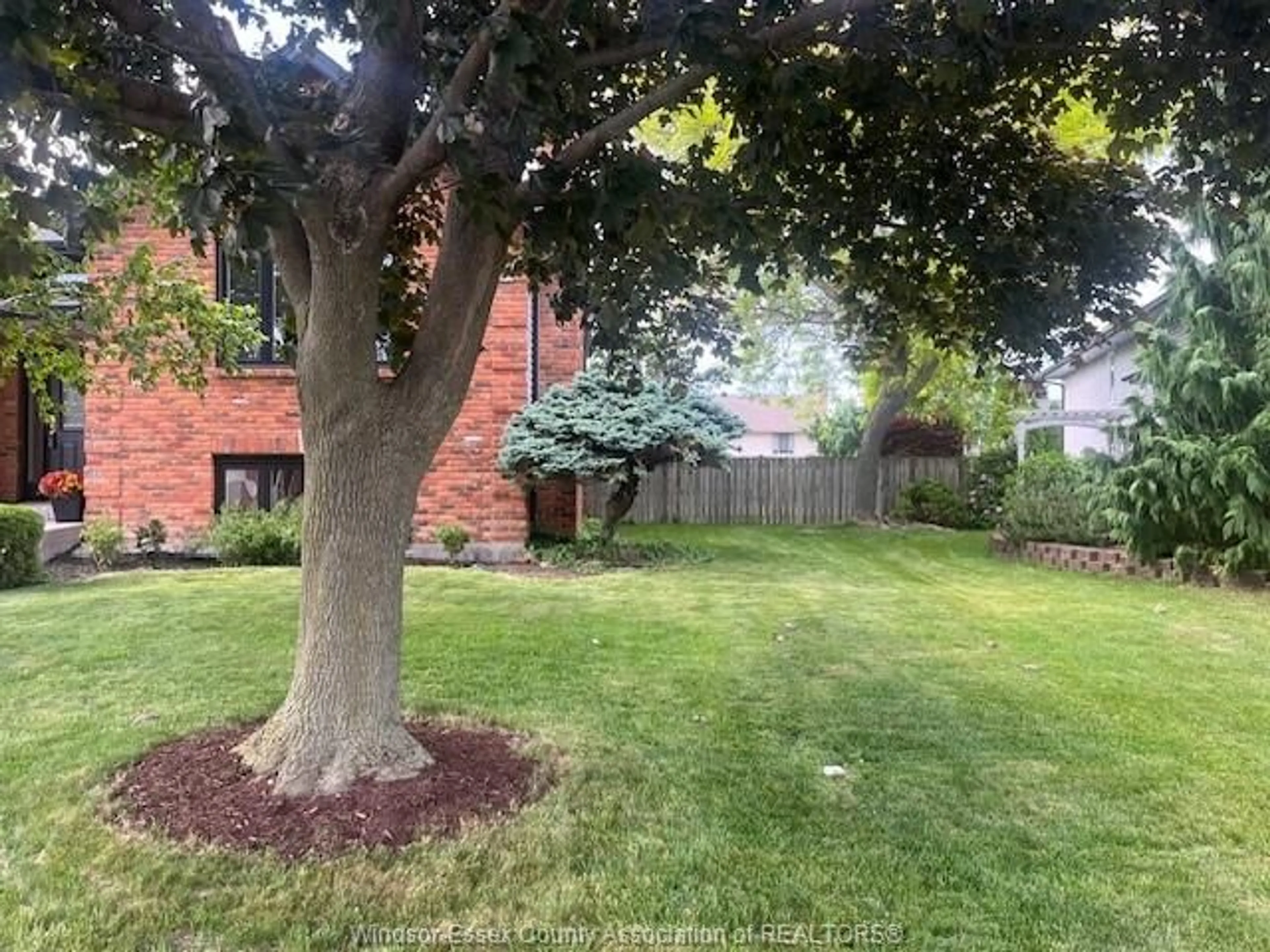 A pic from outside/outdoor area/front of a property/back of a property/a pic from drone, forest/trees view for 12410 MEANDER Cres, Tecumseh Ontario N8N 4P3