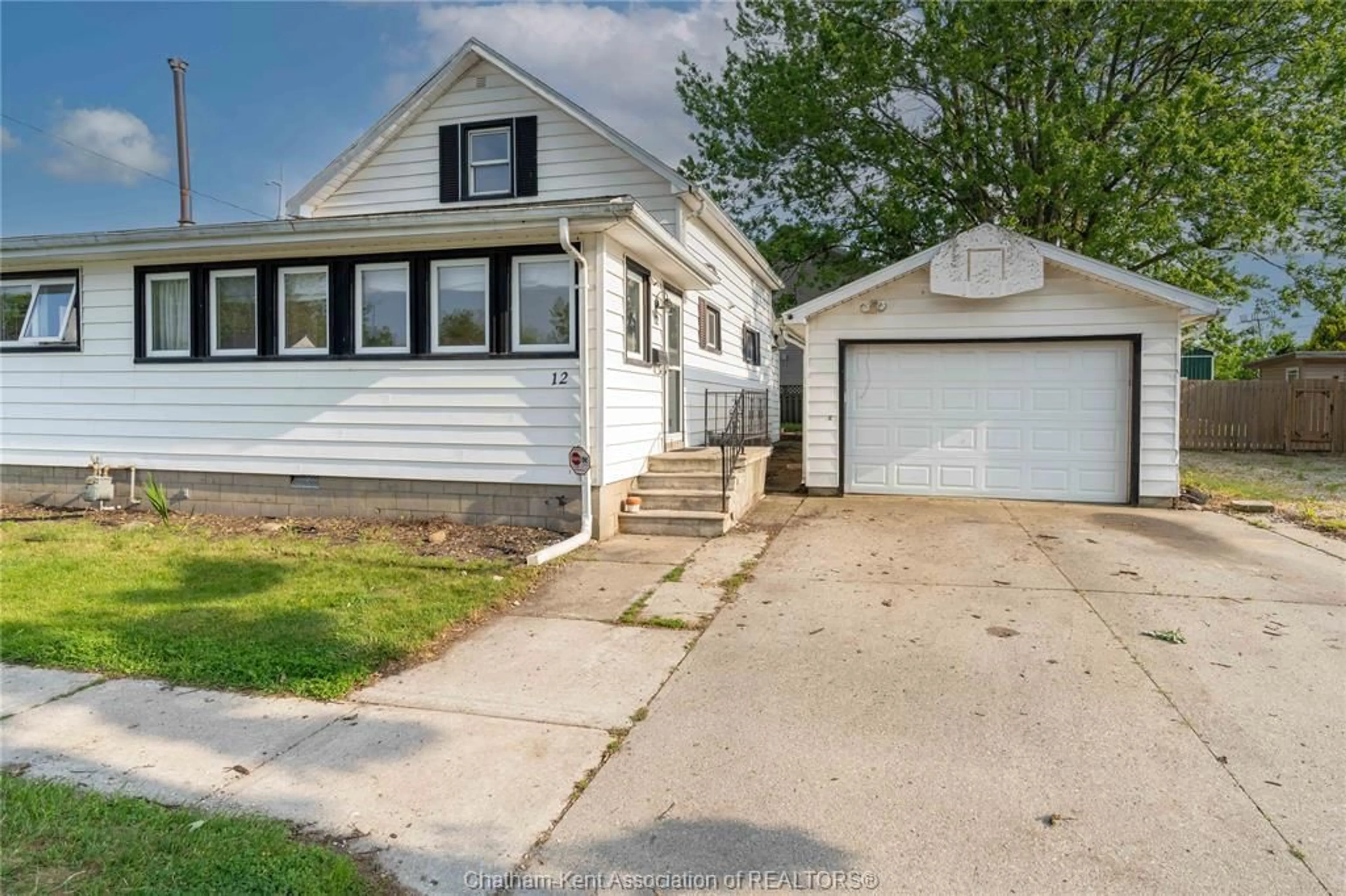 Home with vinyl exterior material, street for 12 MONTGOMERY St, Leamington Ontario N8H 1Z9