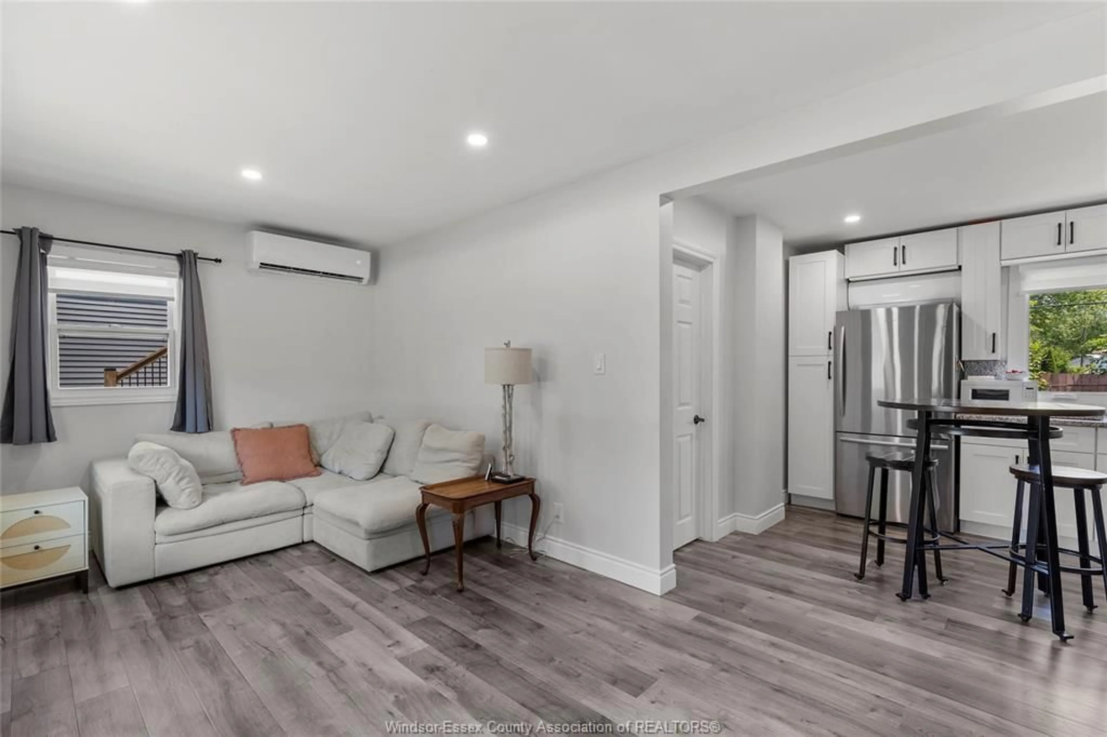 Living room with furniture, wood/laminate floor for 114 NOTTINGHAM, Colchester Ontario N0R 1G0
