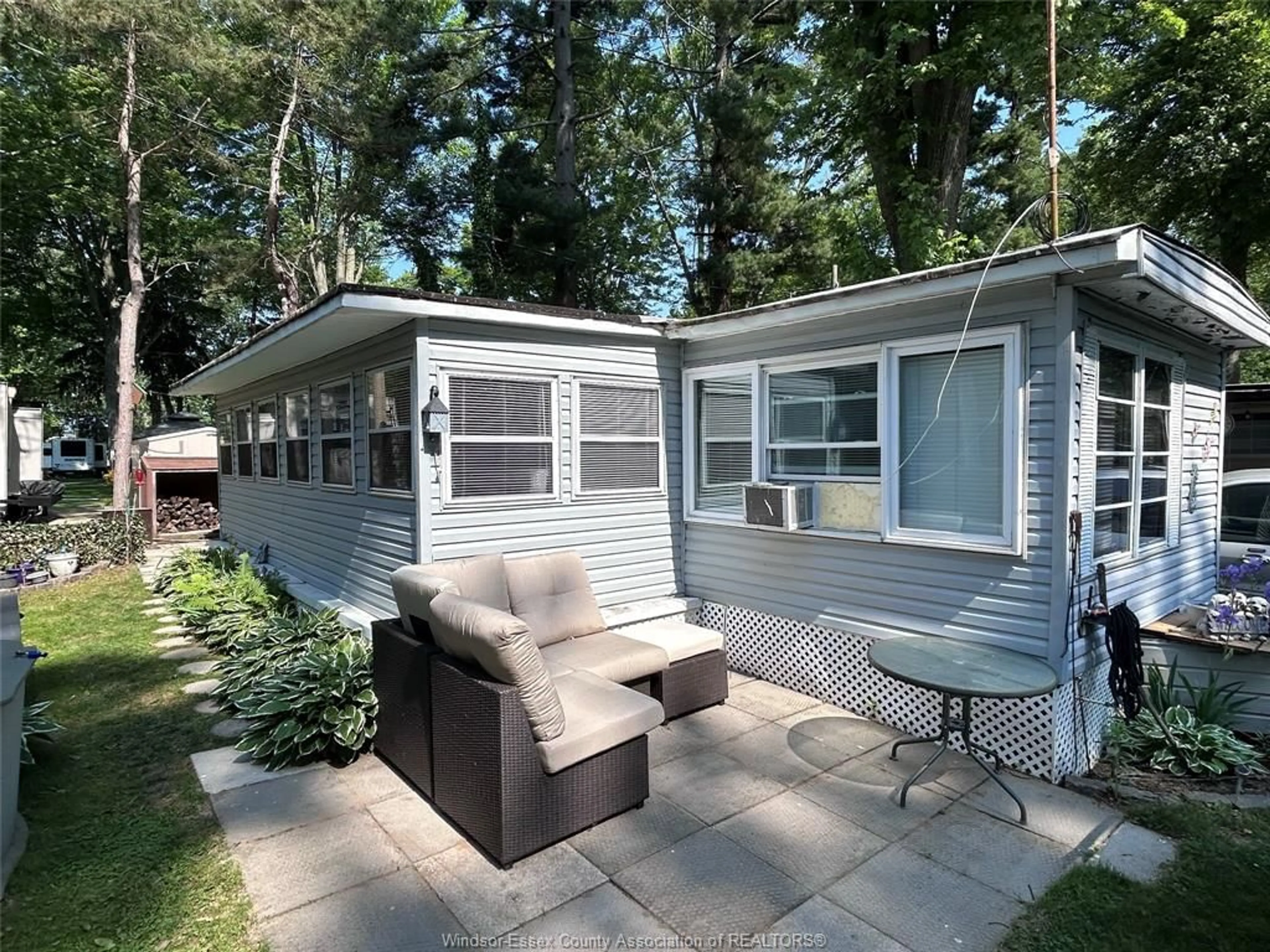 Home with vinyl exterior material, street for 445 COUNTY RD 50 #14, Colchester Ontario N0R 1G0