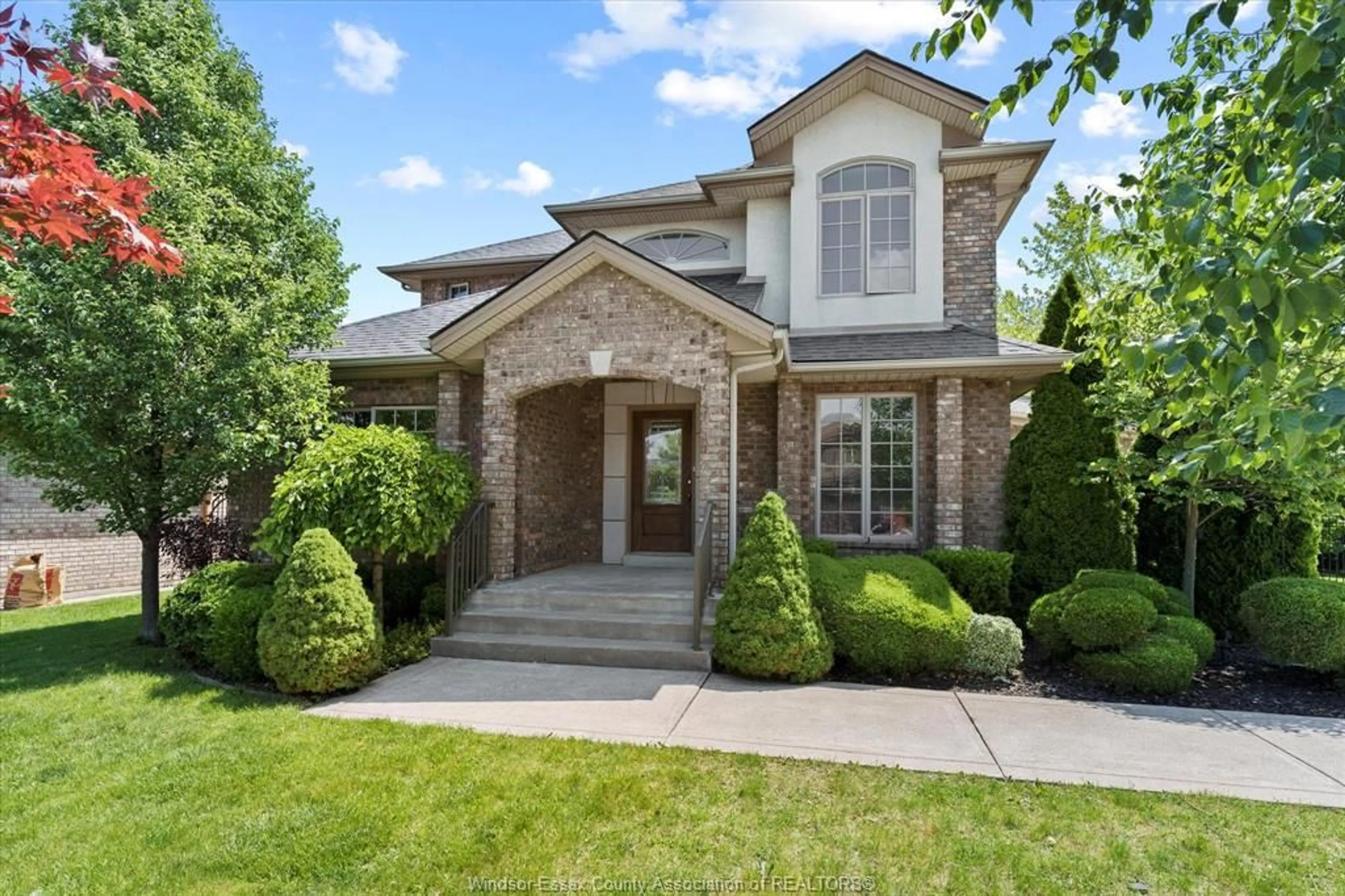 Home with brick exterior material, street for 1387 CROSSWINDS Dr, Lakeshore Ontario N0R 1A0