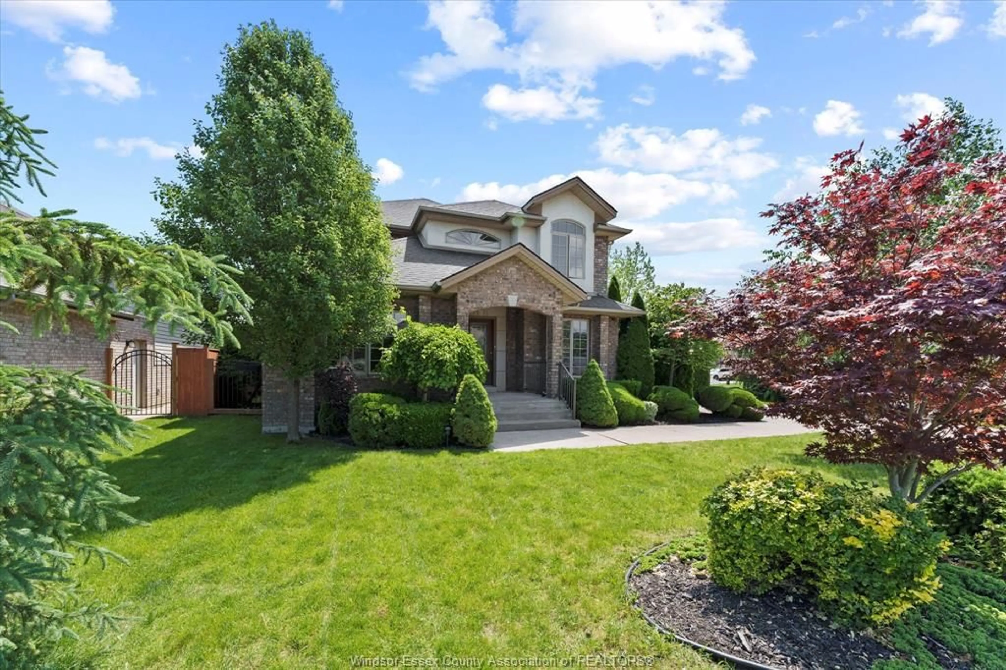 Home with brick exterior material, street for 1387 CROSSWINDS Dr, Lakeshore Ontario N0R 1A0