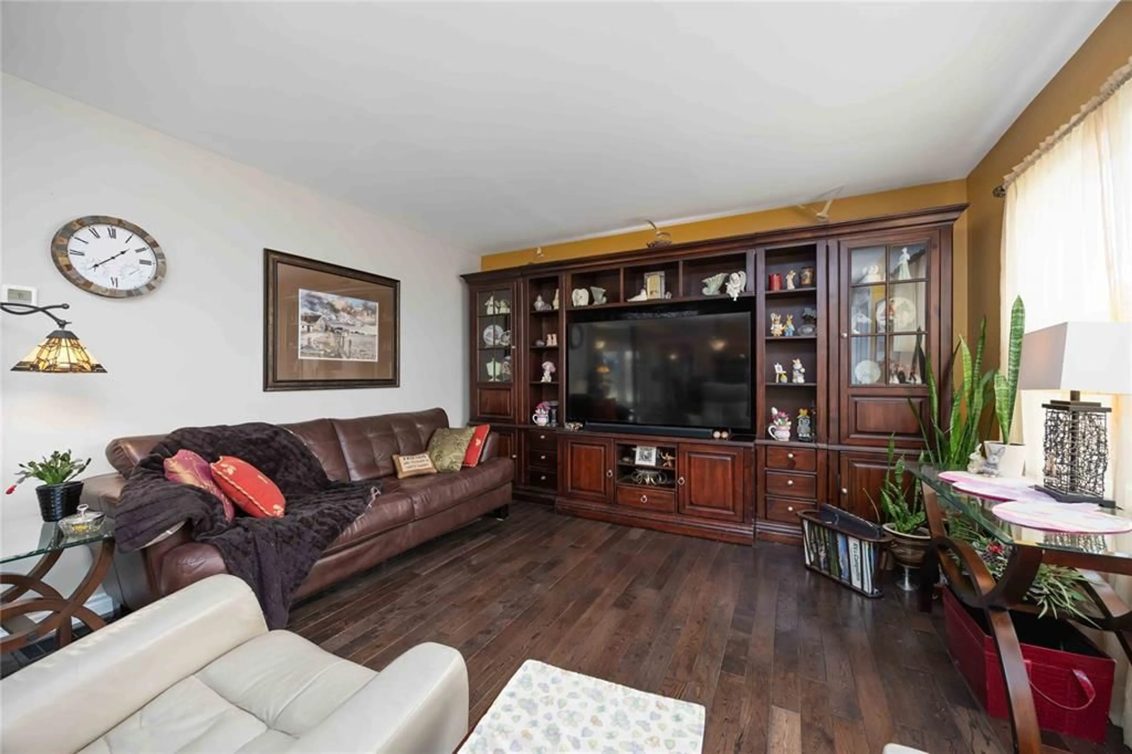 Living room with furniture, wood/laminate floor for 1220 Pulteney St, Moore Township Ontario N0N 1M0