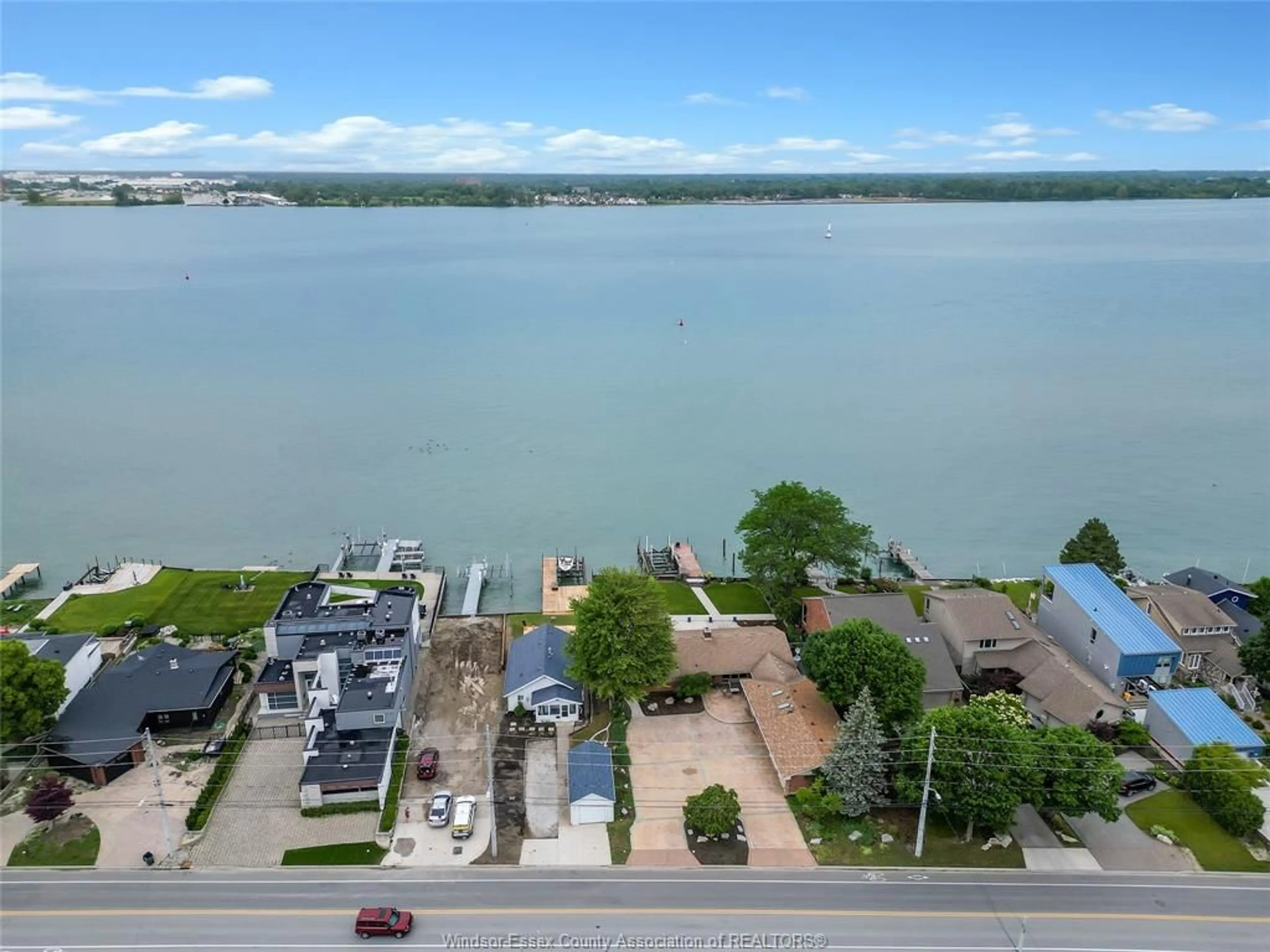 A pic from outside/outdoor area/front of a property/back of a property/a pic from drone, water/lake/river/ocean view for 8266 Riverside, Windsor Ontario N8S 1E6