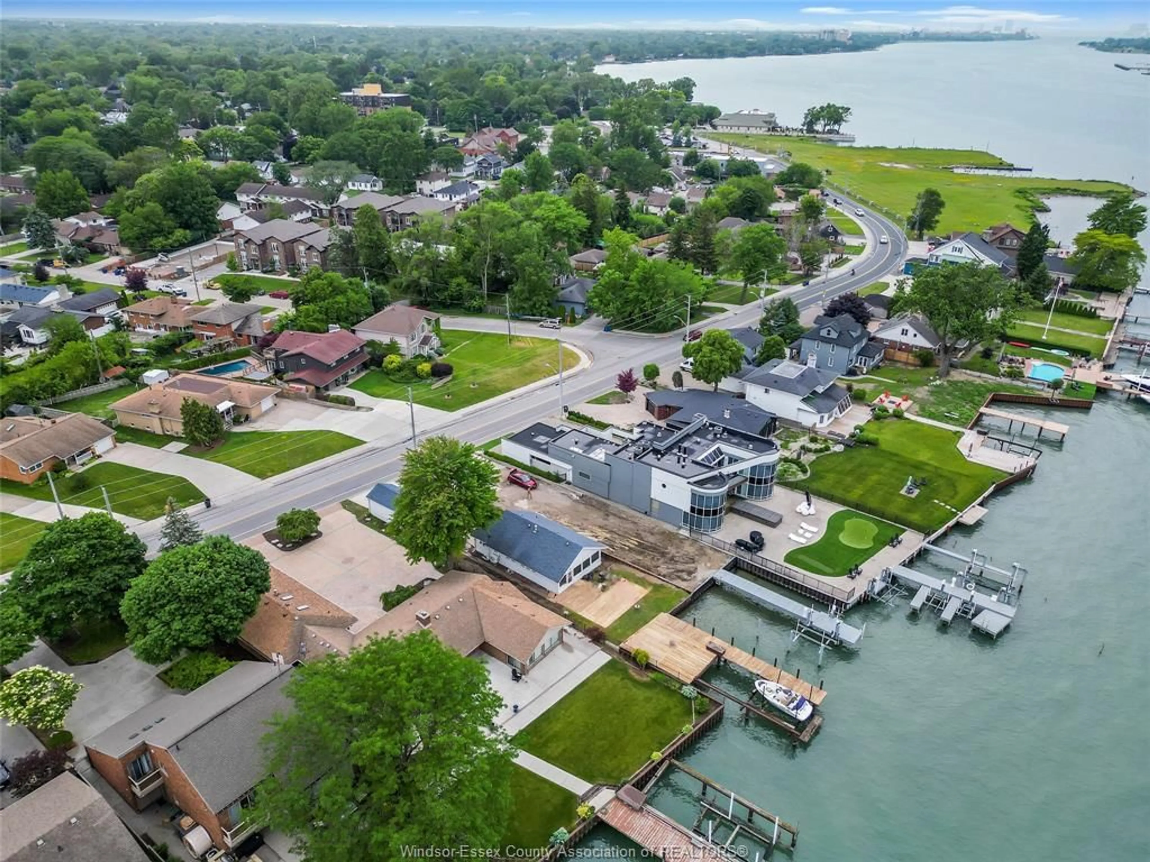 A pic from outside/outdoor area/front of a property/back of a property/a pic from drone, water/lake/river/ocean view for 8266 Riverside, Windsor Ontario N8S 1E6