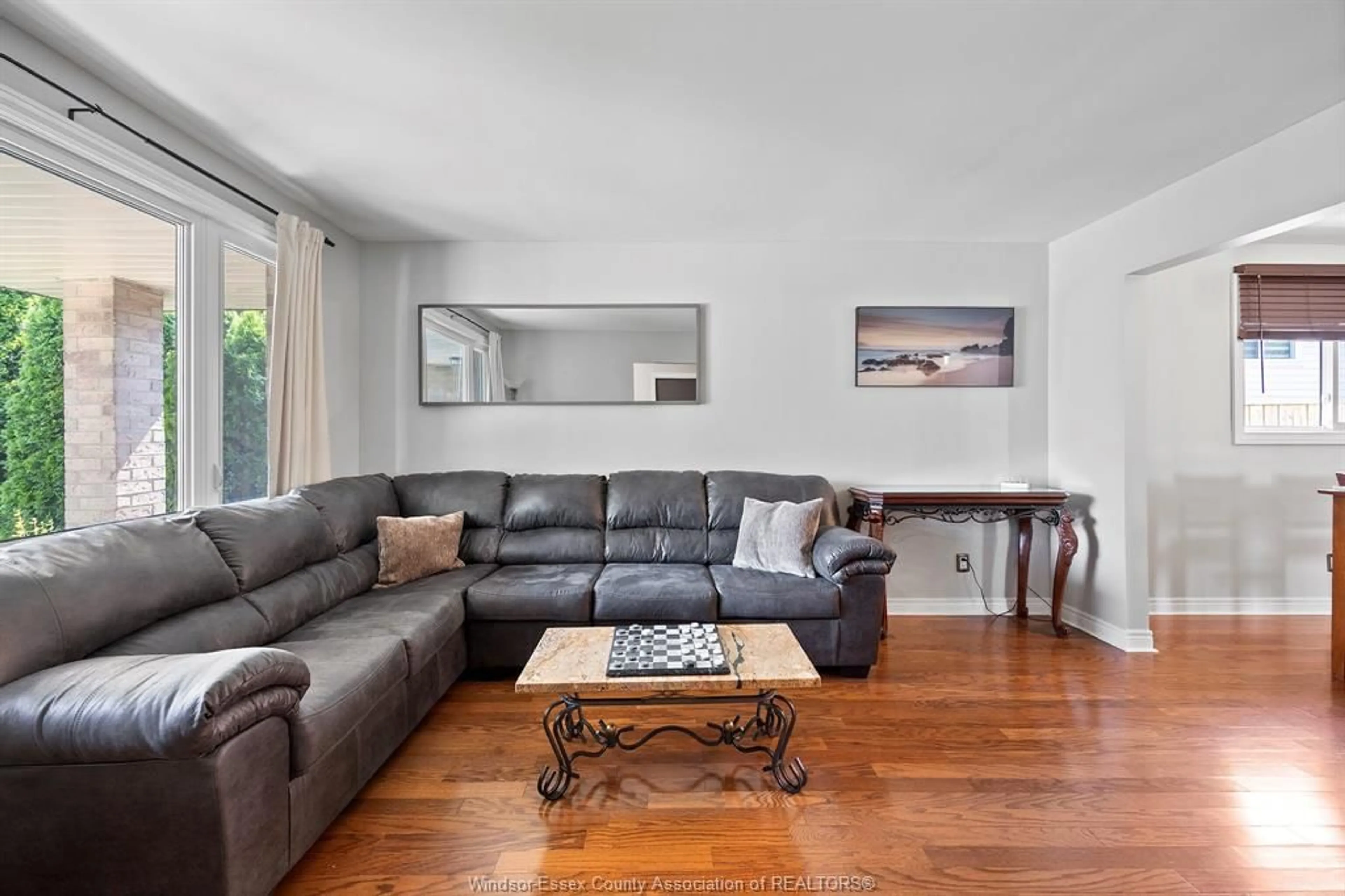 Living room with furniture, wood/laminate floor for 3531 HEMLOCK, Windsor Ontario N8R 2G5
