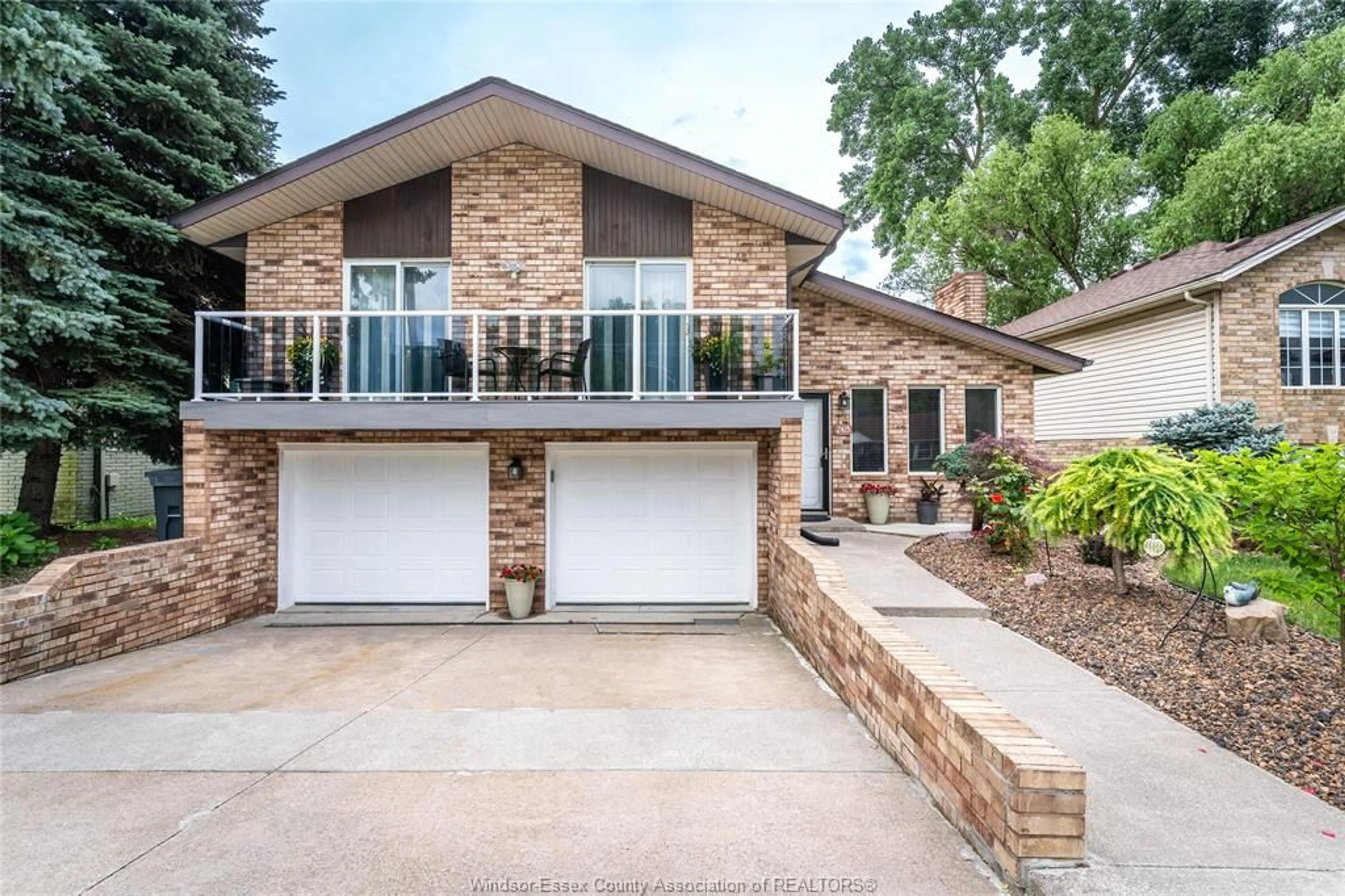Home with brick exterior material, street for 2415 CABANA ROAD  W, Windsor Ontario N9G 1E2