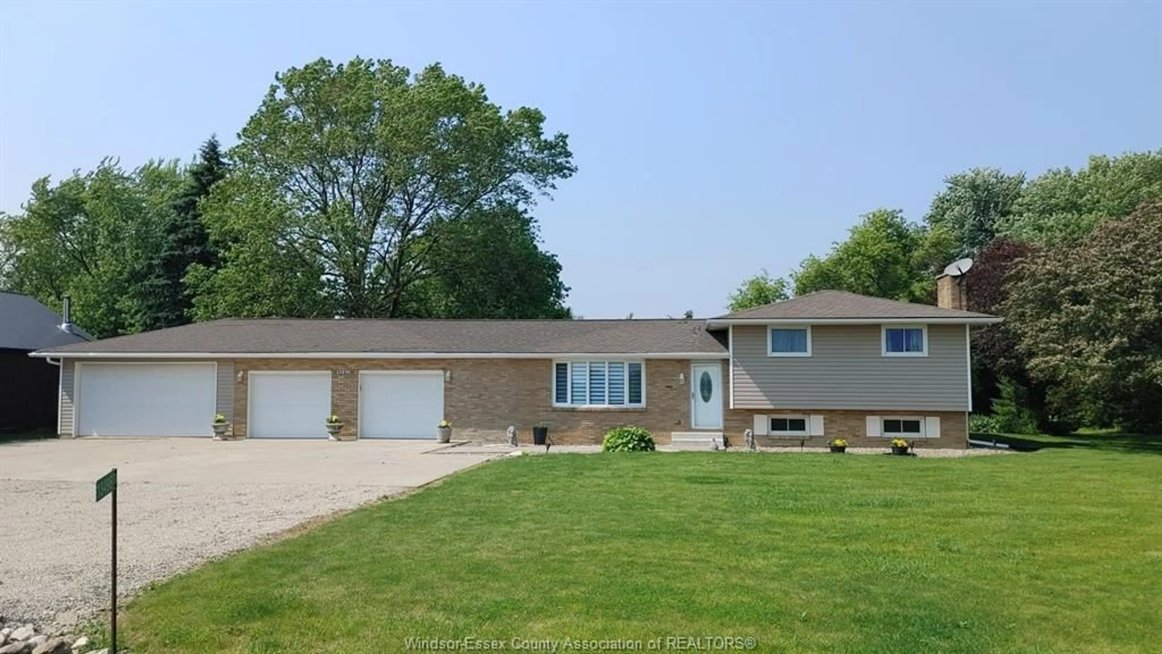 Home with vinyl exterior material, street for 13496 13TH CONCESSION, Essex Ontario N8M 2X6
