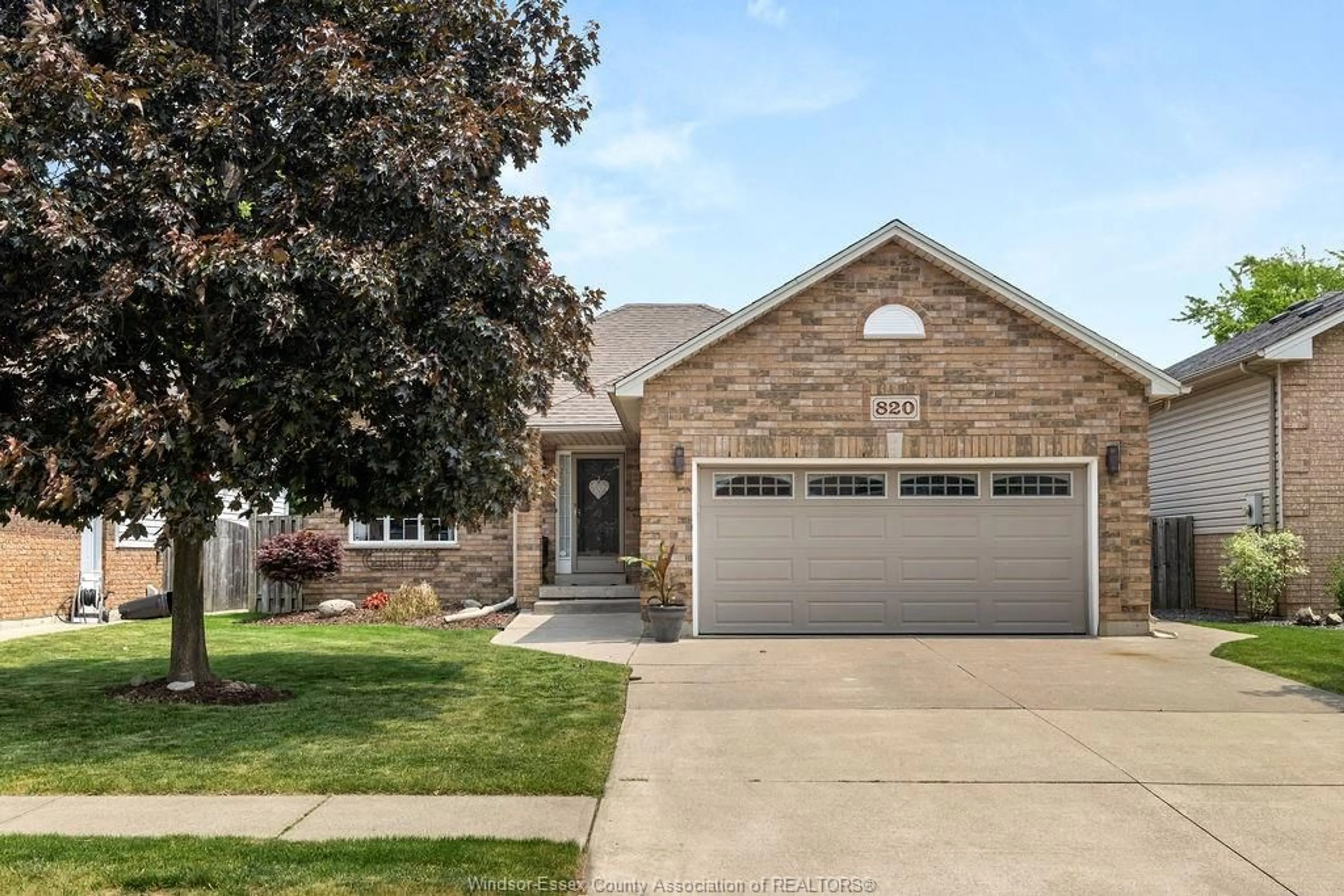 Home with brick exterior material, street for 820 REVLAND Dr, Tecumseh Ontario N8N 5B2