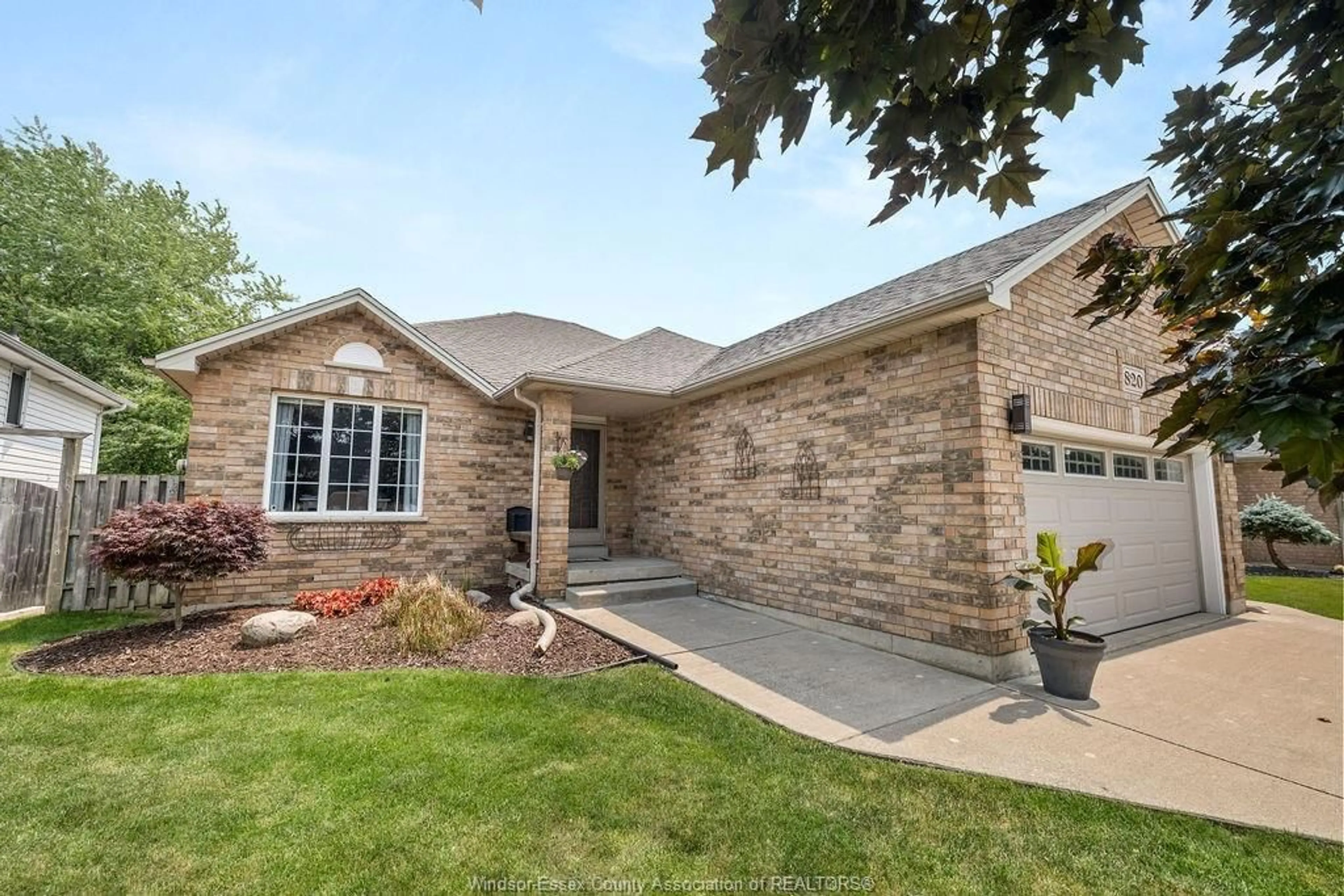 Home with brick exterior material, street for 820 REVLAND Dr, Tecumseh Ontario N8N 5B2
