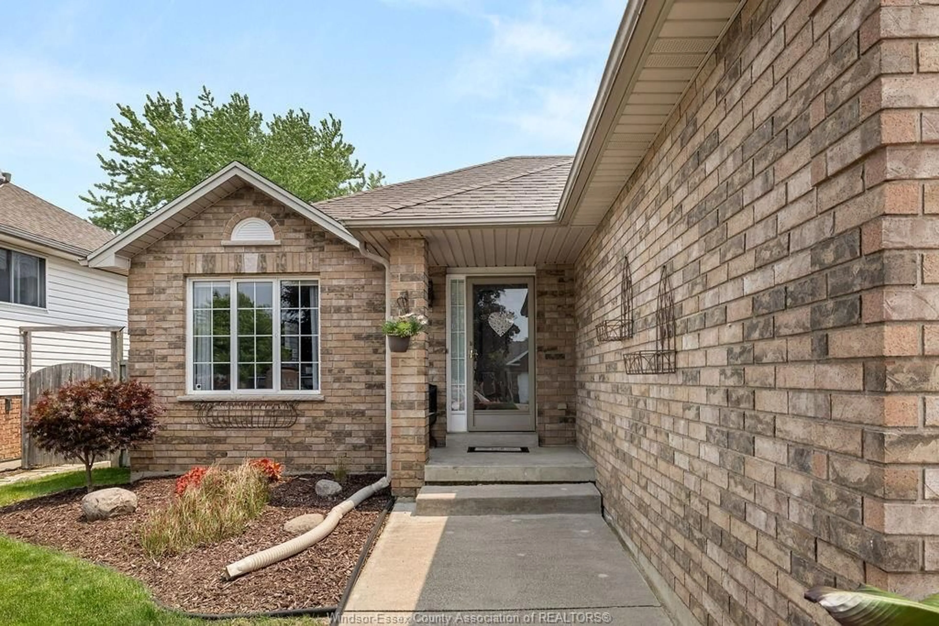 Home with brick exterior material, street for 820 REVLAND Dr, Tecumseh Ontario N8N 5B2