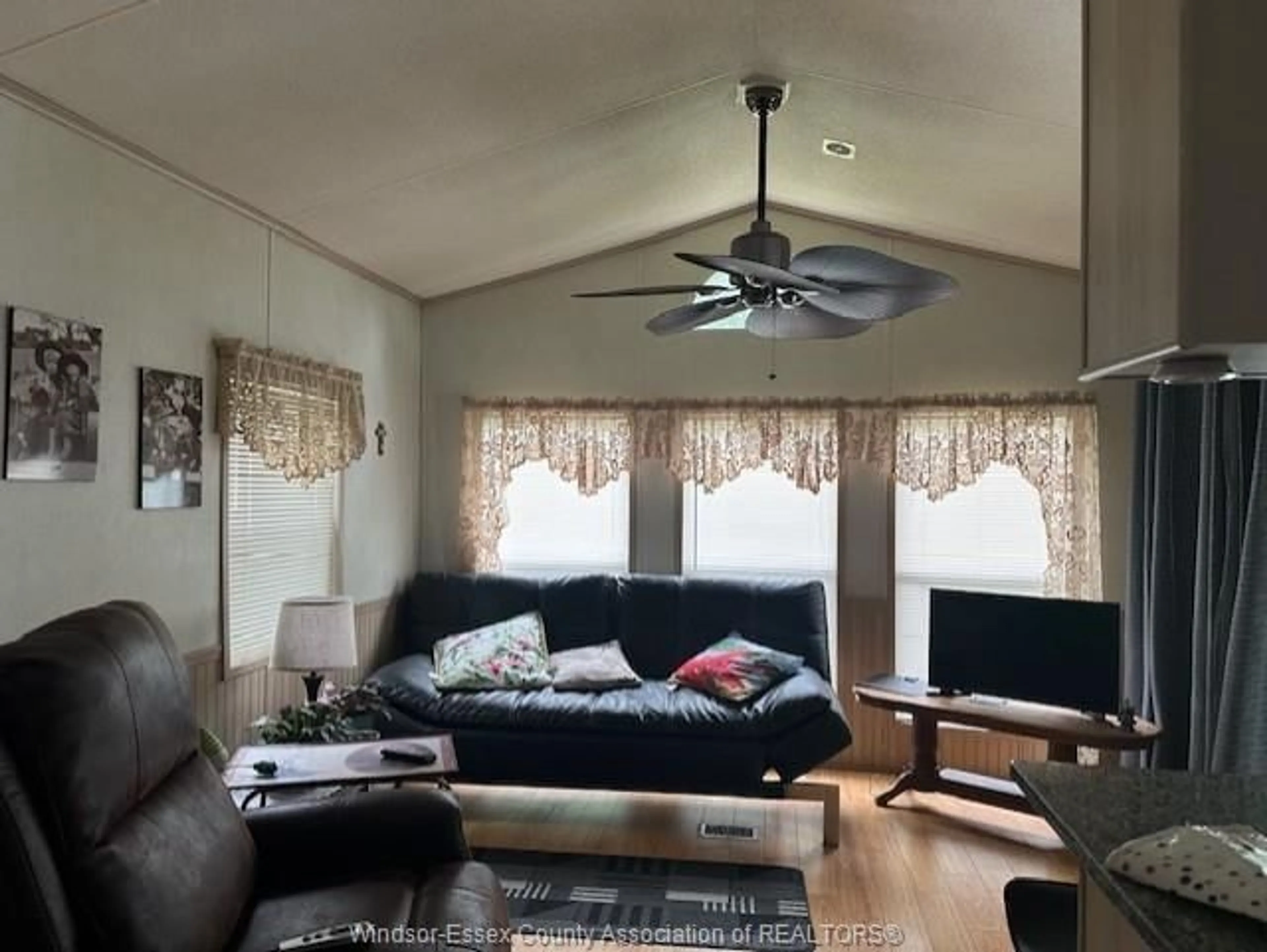 Living room with furniture, wood/laminate floor for 17 PEARTREE, Colchester Ontario N0R 1G0