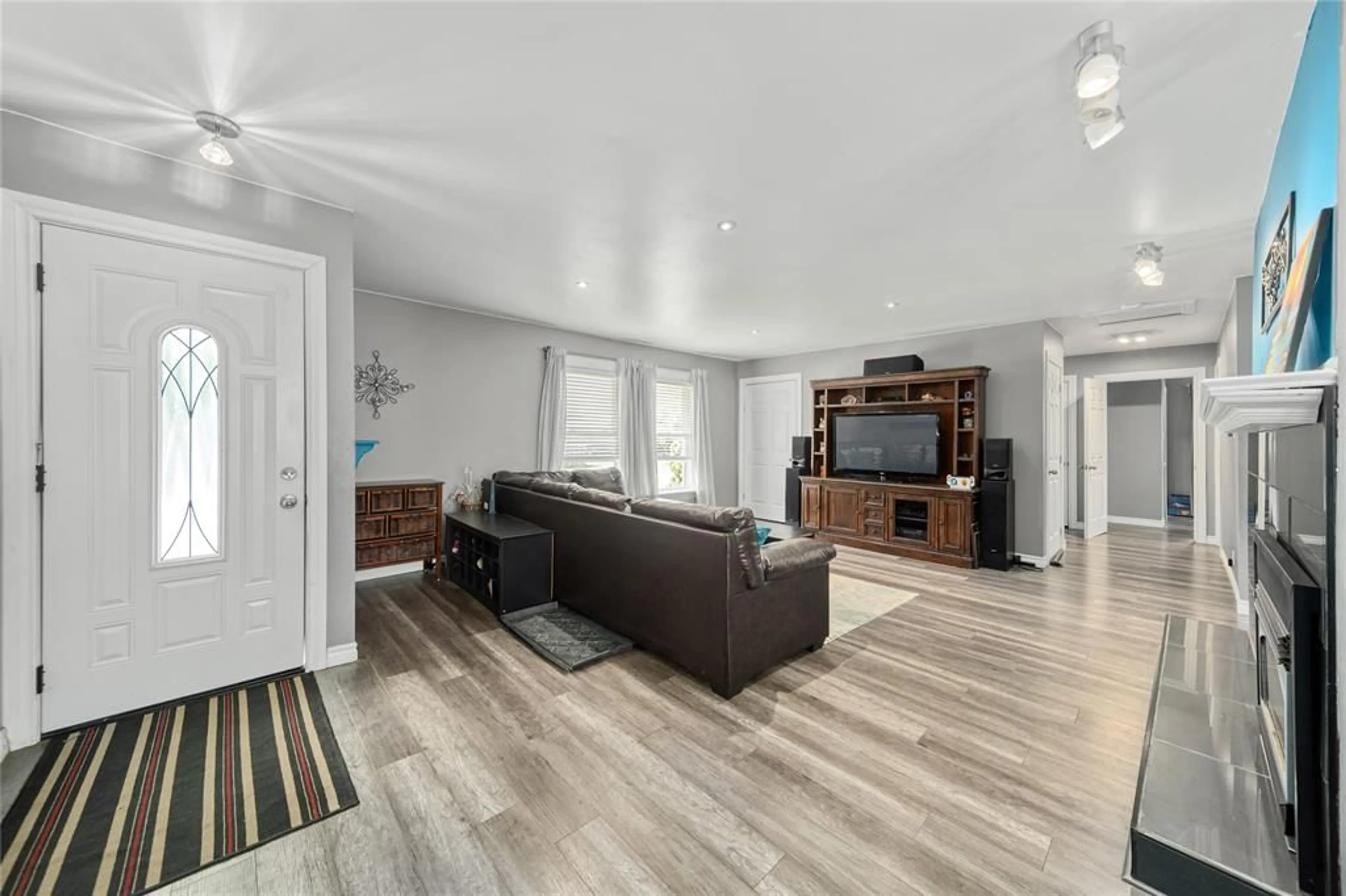 Living room with furniture, wood/laminate floor for 3073 Main St, Oil City Ontario N0N 1N0