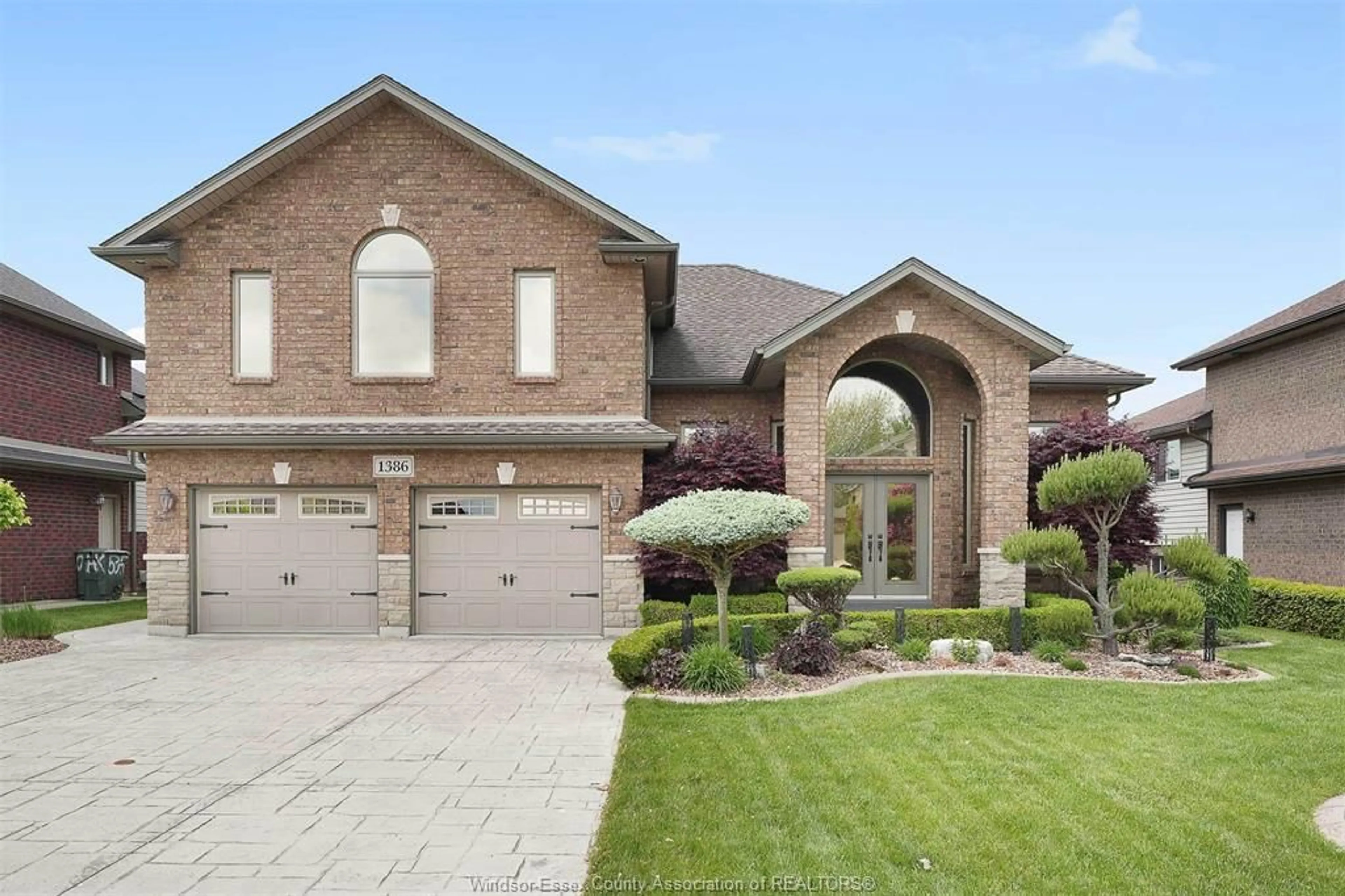 Home with brick exterior material, street for 1386 CROSSWINDS Dr, Lakeshore Ontario N0R 1A0