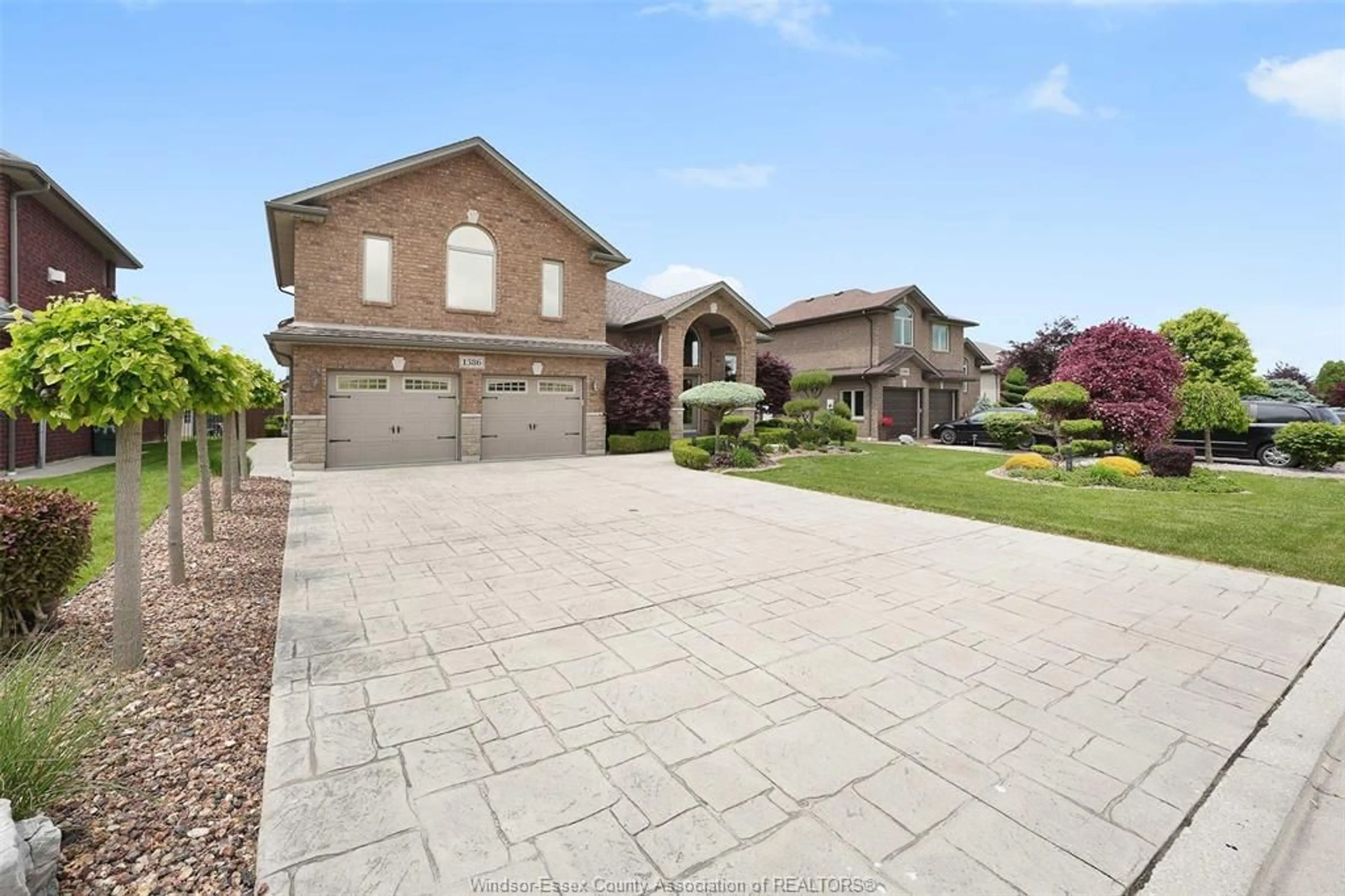 Home with brick exterior material, street for 1386 CROSSWINDS Dr, Lakeshore Ontario N0R 1A0